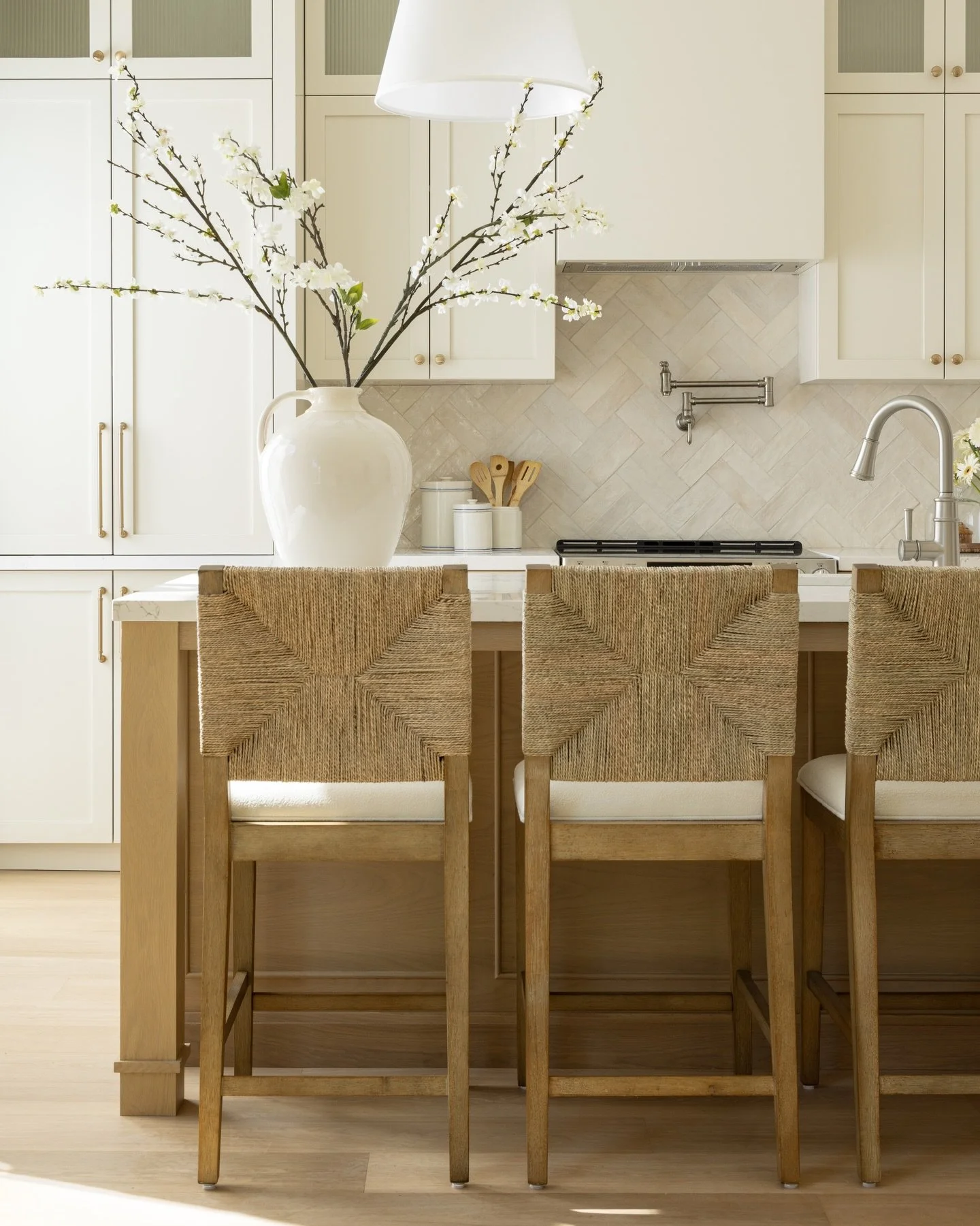 The Project Richie kitchen proves that neutrals are anything but boring.⁠
⁠
@caesarstone Celestial Sky countertops are the perfect match to our painted maple cabinetry and white oak island. ⁠
⁠
For the island, we applied custom moulding to the sides 