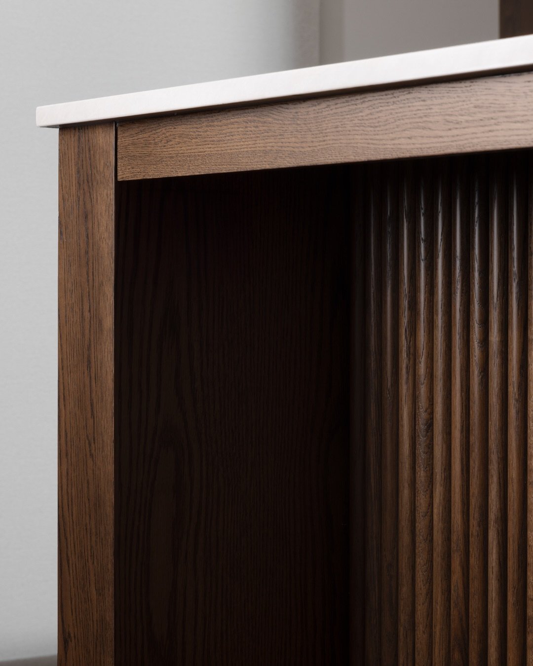 Design details in our Roncesvalles kitchen that blend function and flow.⁠
⁠
Fluted cabinets add classic, Art Deco-inspired character to the kitchen while recessed LED cabinet lighting and built-in pantry organizers bring ease to everyday routines. We