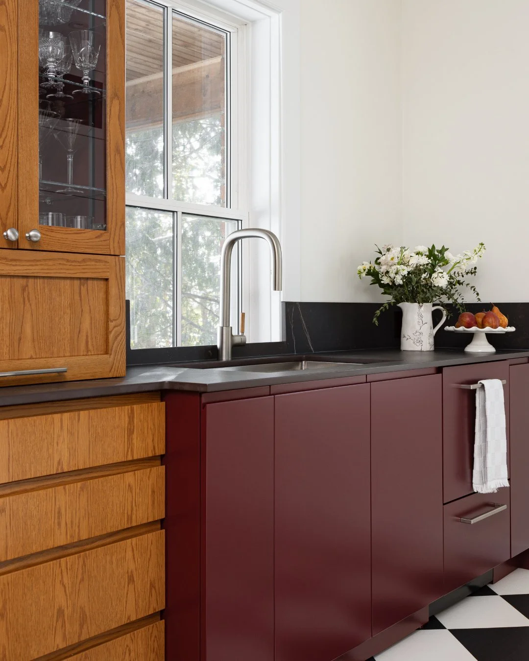 Project Swiss Army Knife is full of tricks and treats hiding behind that maroon-red cabinetry.⁠
⁠
Alongside our custom spice rack and cutting board storage, two of our more familiar features, we built in pull-out doors to conceal appliances, toe-kick