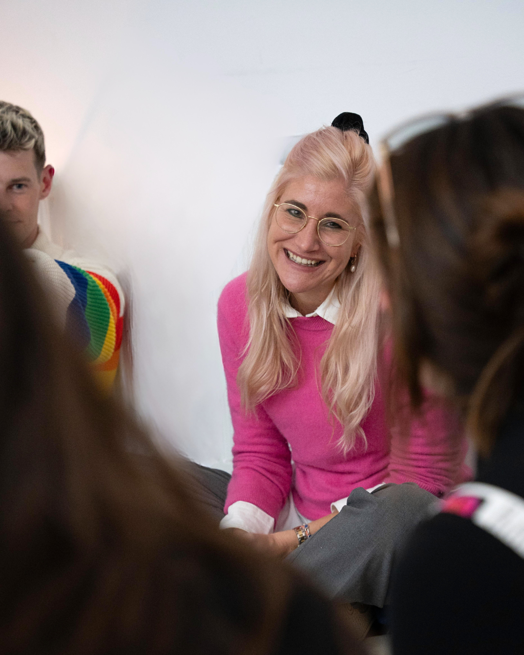 Zoe Coetzee, expressive arts facilitator at the sozo space, laughing in a group workshop