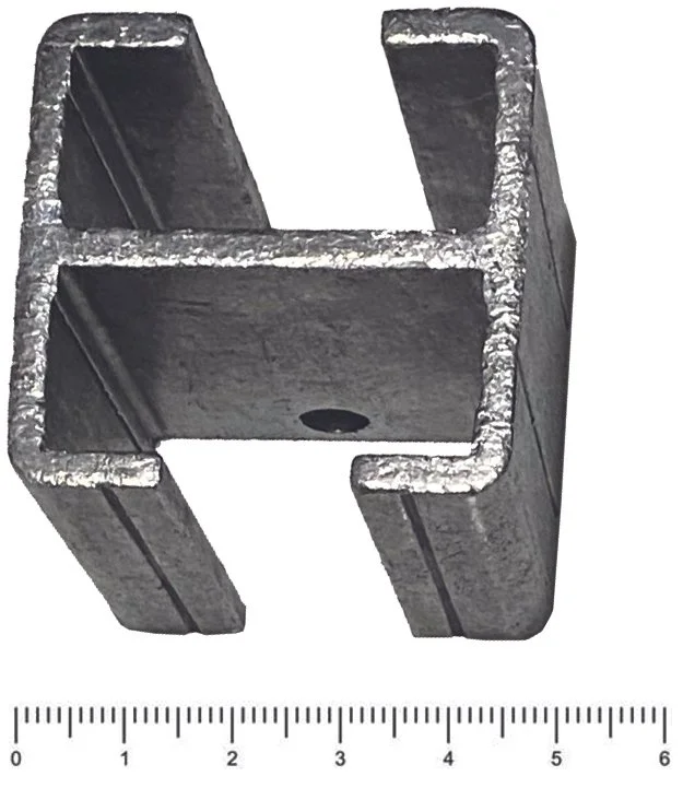 Example of an integral, H shaped bus with reference ruler for size.