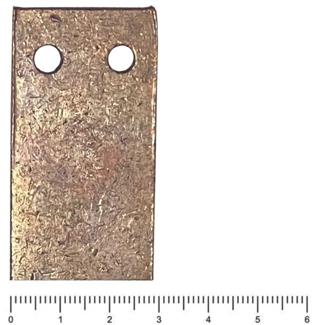 Example of a copper bus bar with reference ruler for size.