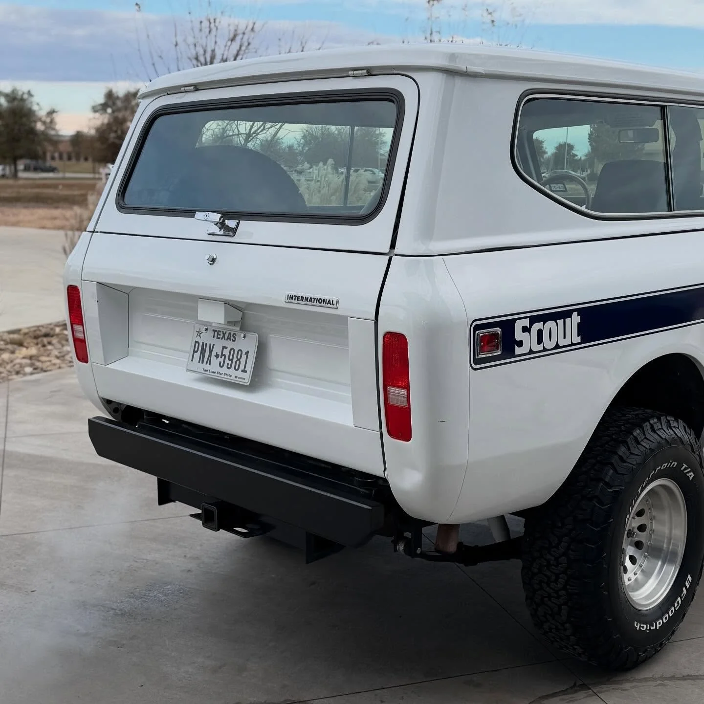 1977 Scout completed a full transformation. We pulled out a deep gloss to this white paint and protected it with a very slick dual-layer ceramic coating. 

The glass was dull and hazy when it came in (typical of older glass panels that have been negl