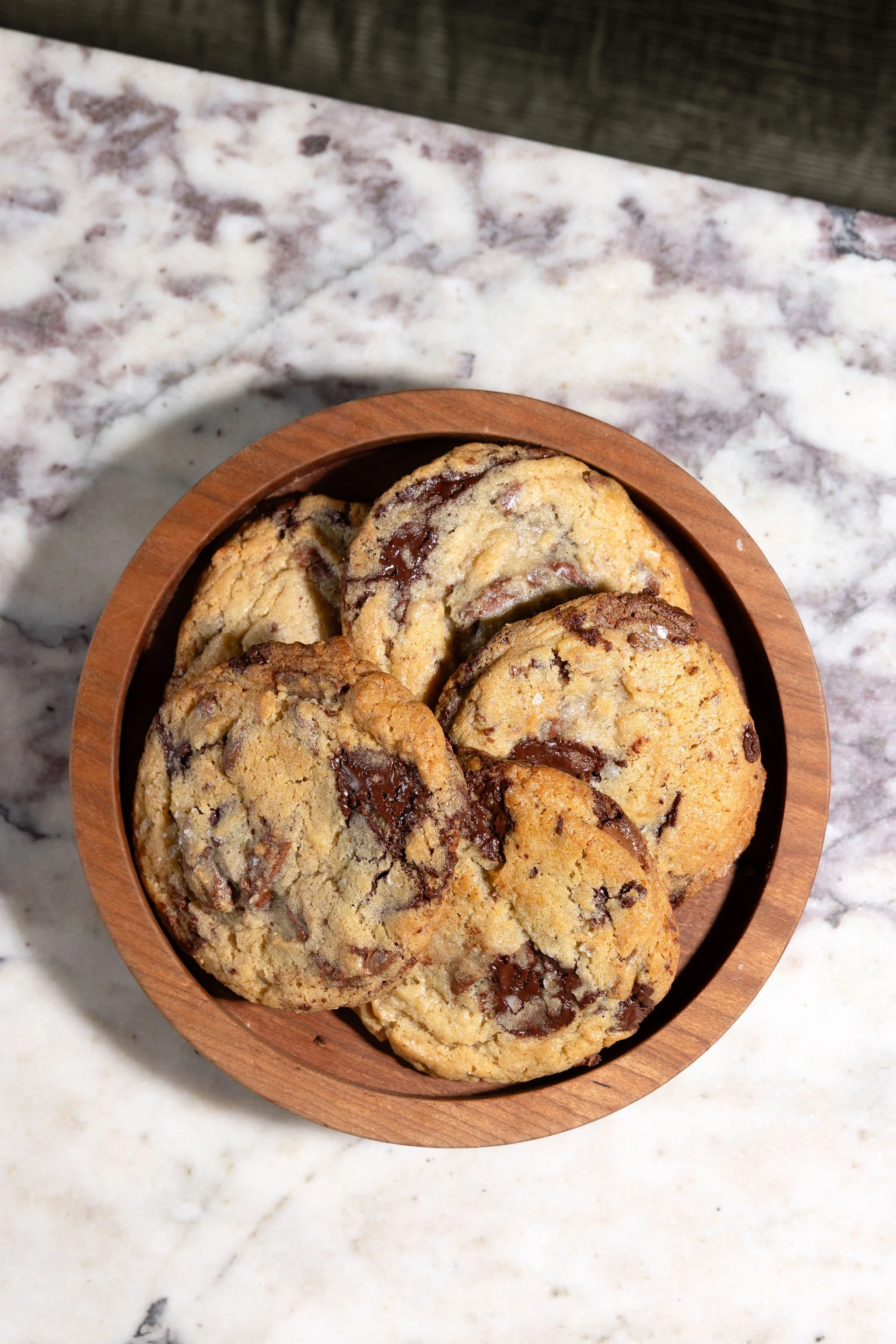a plate of chocolate chip cookies