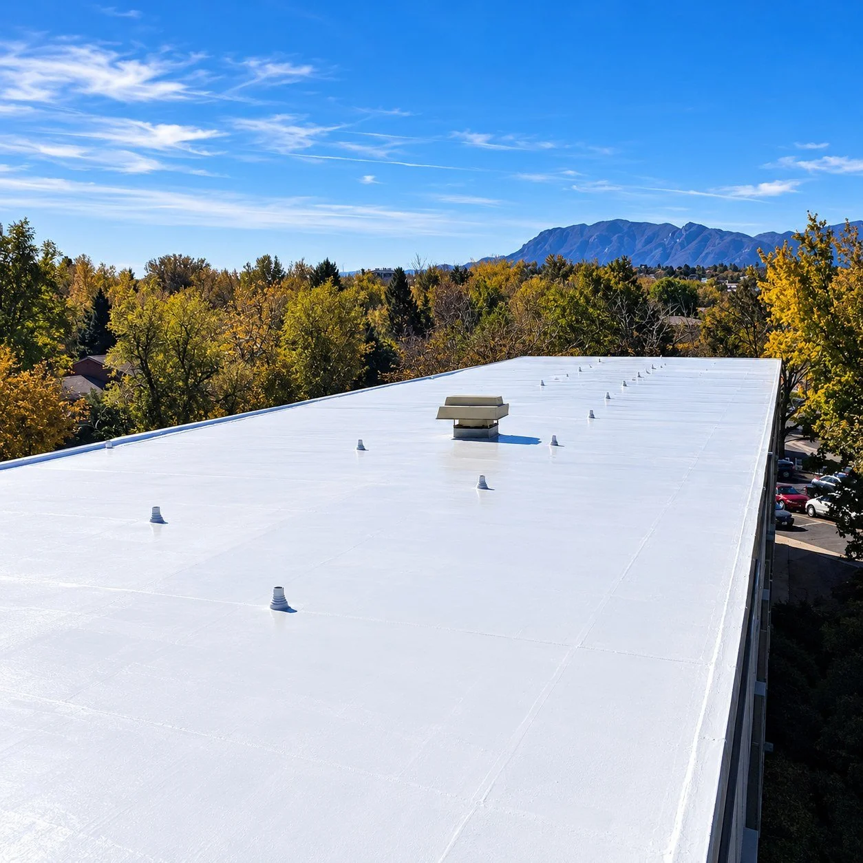 Finished white silicone flat roof coating with 20-year NDL warranty