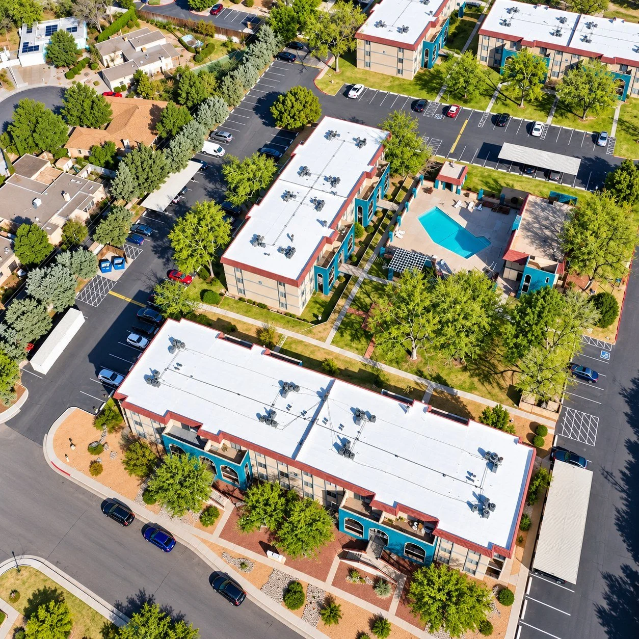 Apartment complex flat roofs restored with silicone roof coating - multifamily roofing Florida