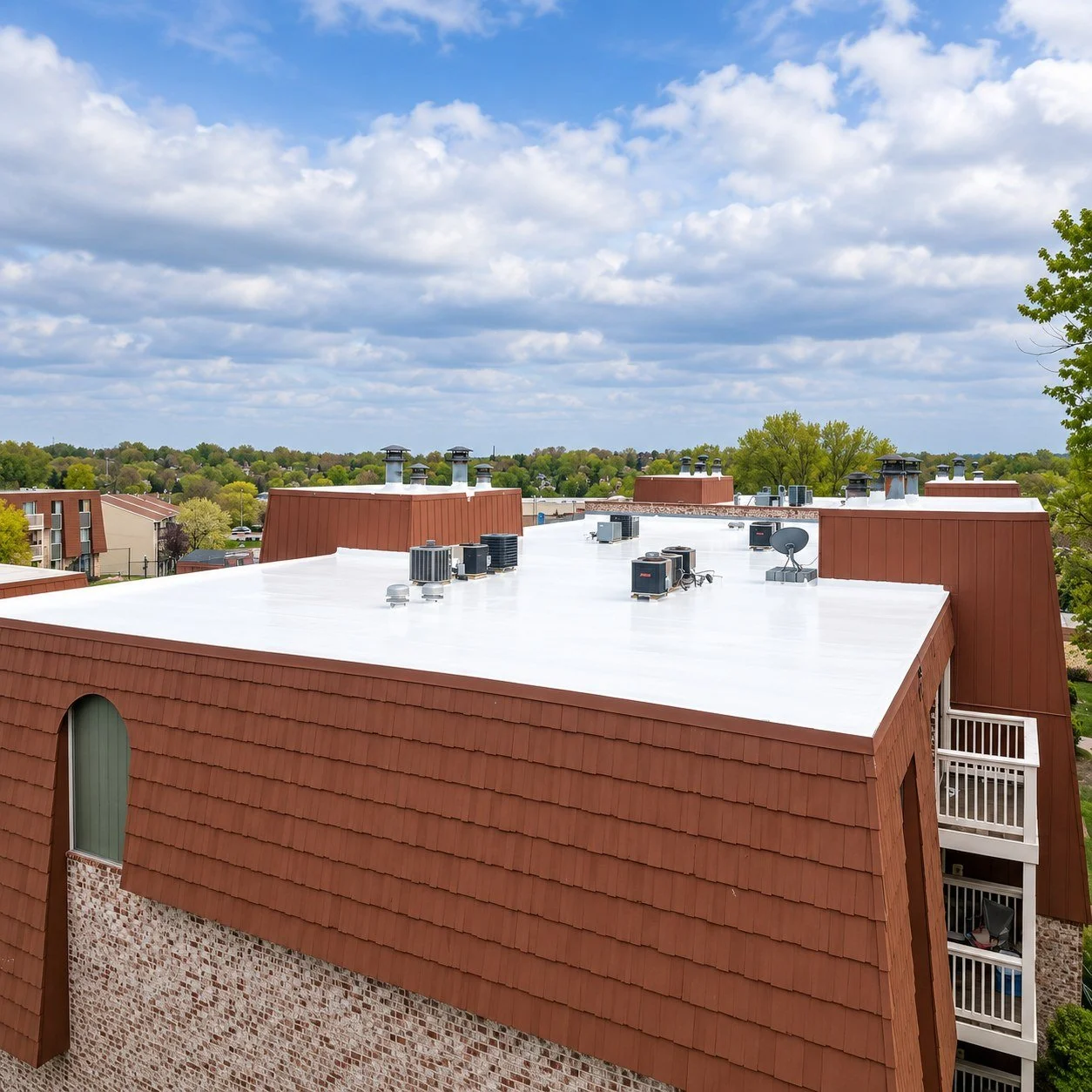 greenlight-white-roof-coating-mansard-building.jpg