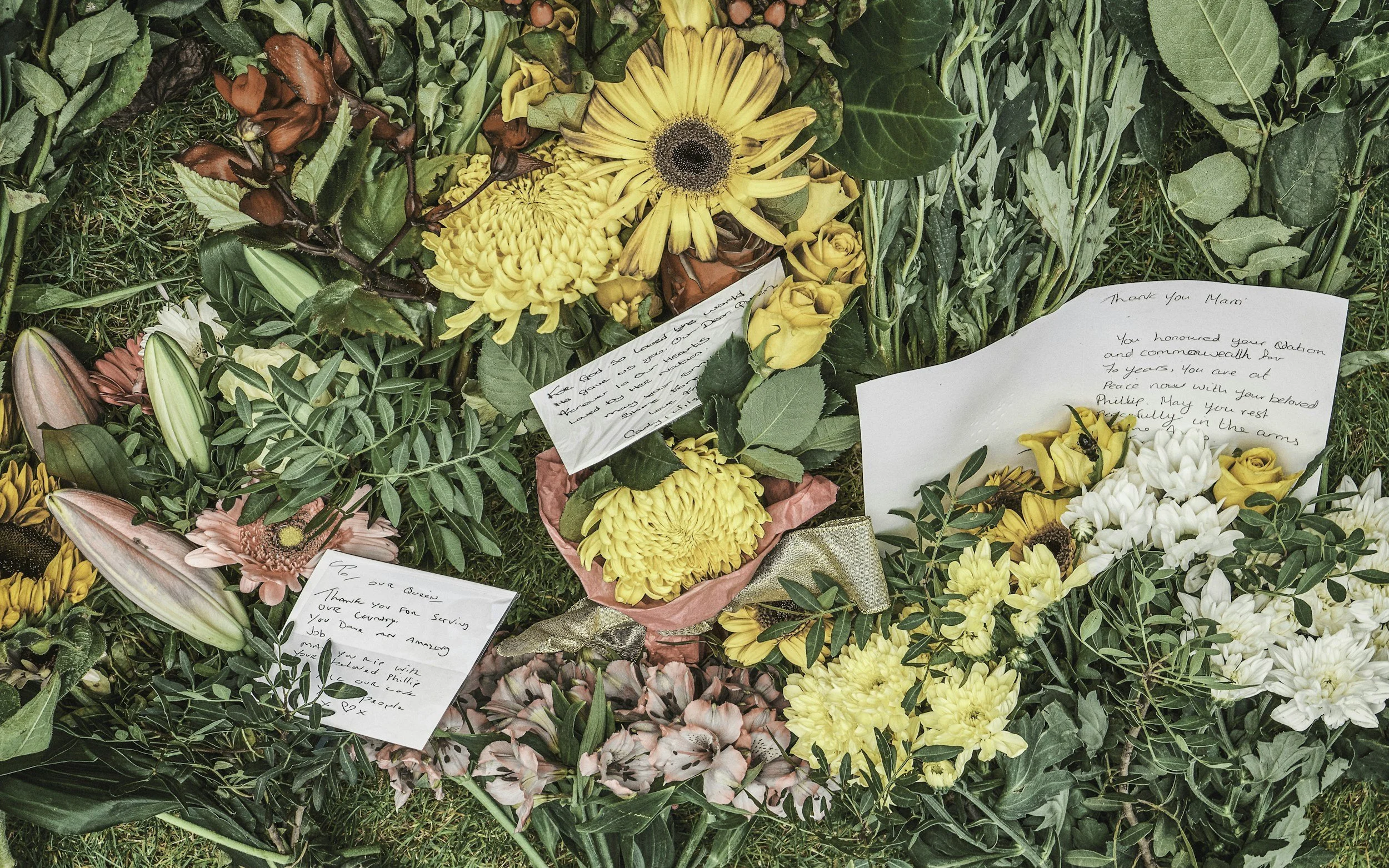 Flowers and notes representing grief and loss