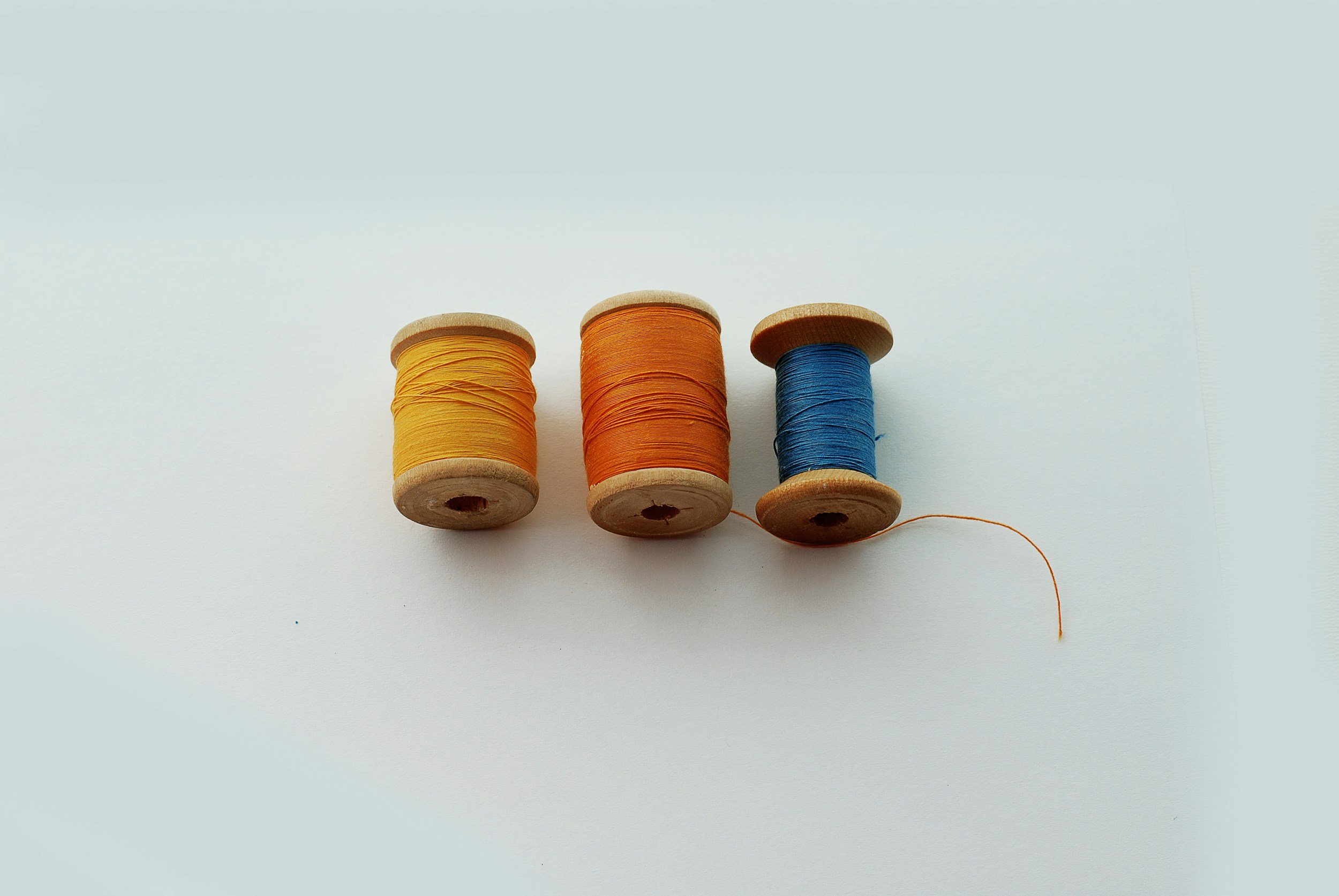 Spools of thread showing how counseling can explore themes, patterns, connection and universal feelings we share.