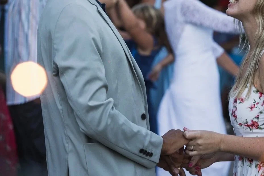 Couple holding hands reconnecting after birth of child