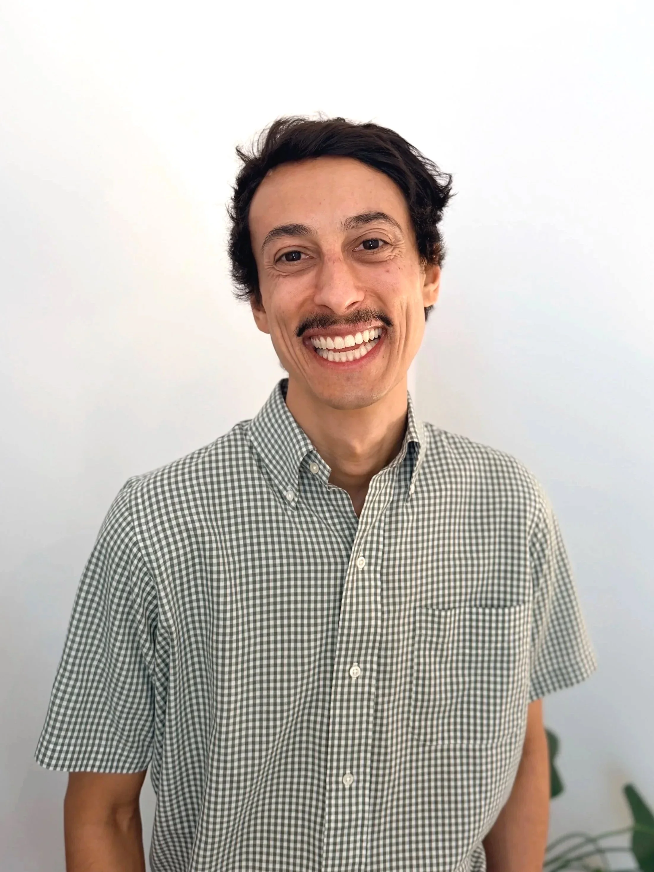 Smiling, friendly male therapist in Logan Square Chicago office