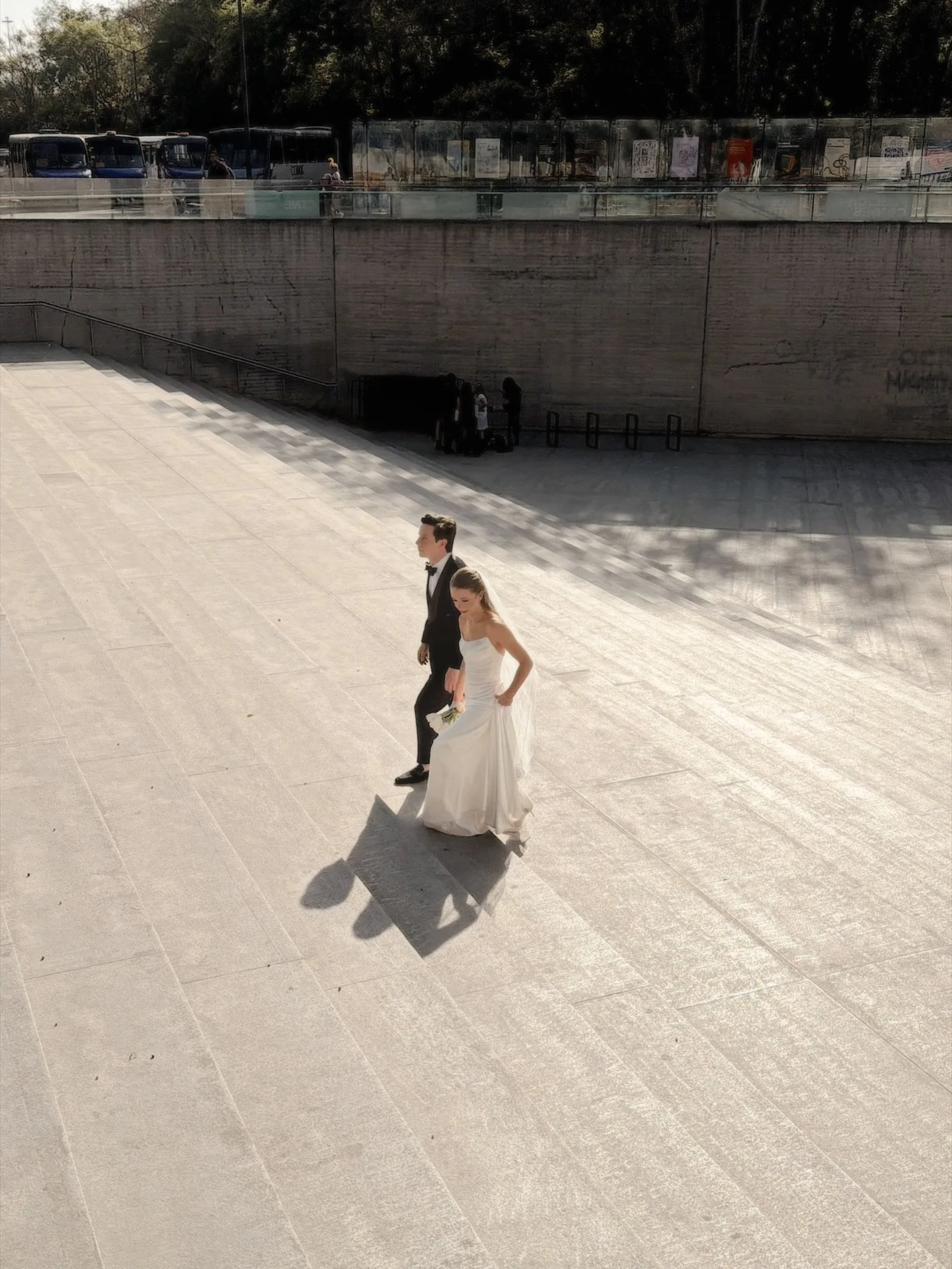 Wedding portrait with iPhone &mdash; CITY EDITION

Just two newlyweds, impeccably dressed, walking through Mexico City as if it were their own runway.

On the day they said I do, they stepped into the city instead of a stage &mdash; through the iconi