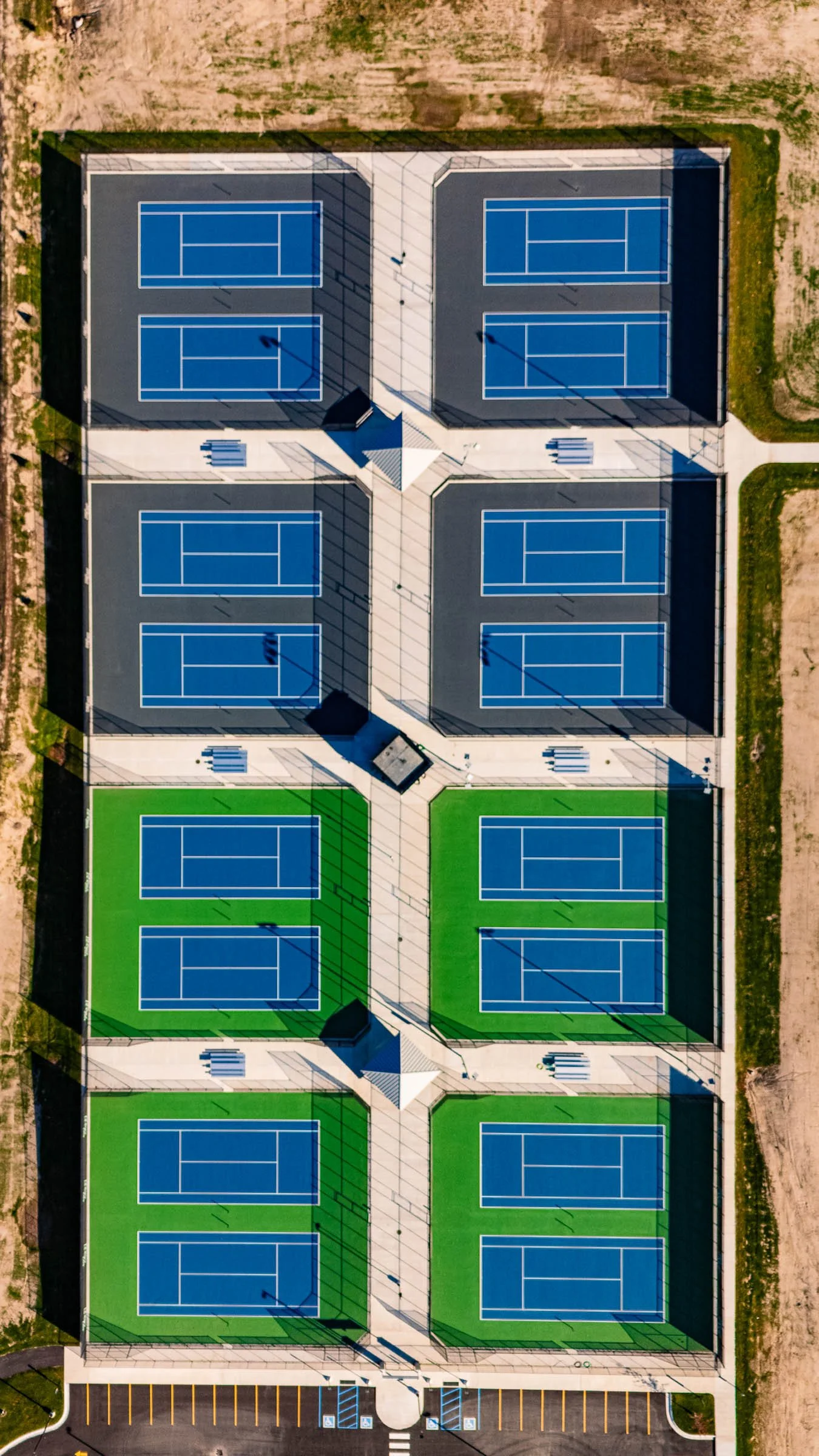 Aerial view of a multi-court tennis facility featuring sixteen tennis courts with in Zeeland Michigan