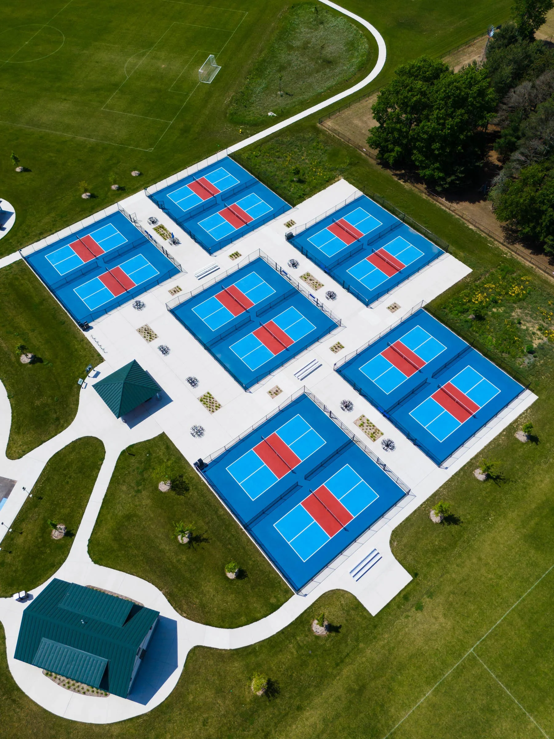 Corner aerial view of Schmidt Heritage sport court complex — pickleball court construction by Racquet Sports Inc. of Michigan.