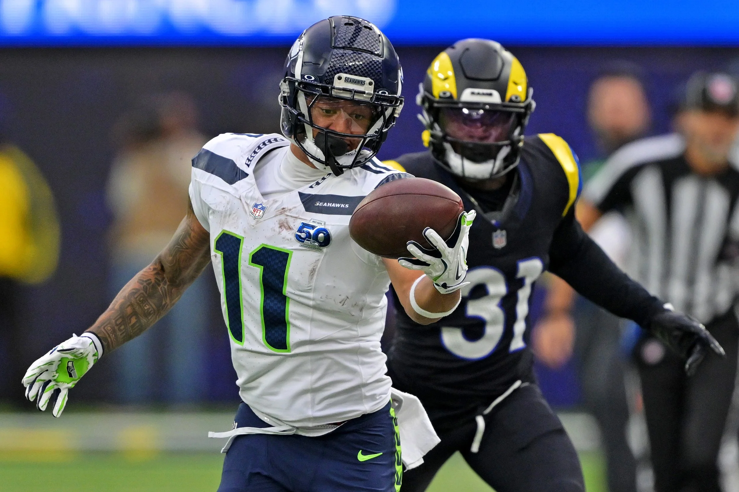 Seattle Seahawks wide receiver Jaxon Smith-Njigba (11) makes a one handed catch against Los Angeles Rams cornerback Darious Williams (31) during the first half at SoFi Stadium. Mandatory Credit: Jayne Kamin-Oncea-Imagn Images