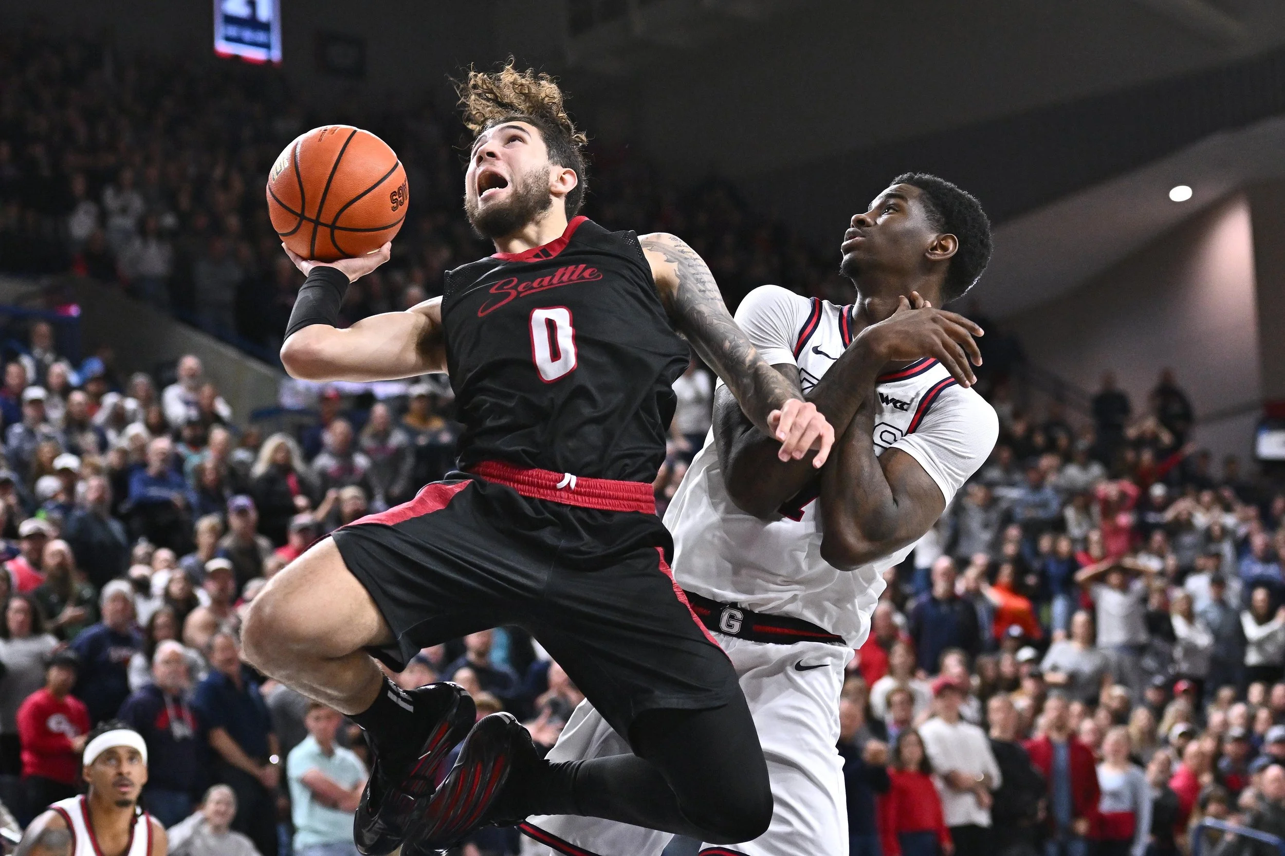Seattle U Redhawks guard Brayden Maldonado (0) is fouled on the shot by Gonzaga Bulldogs guard Tyon Grant-Foster (7) in overtime at McCarthey Athletic Center. Gonzaga Bulldogs won 80-72 in overtime. Mandatory Credit: James Snook-Imagn Images