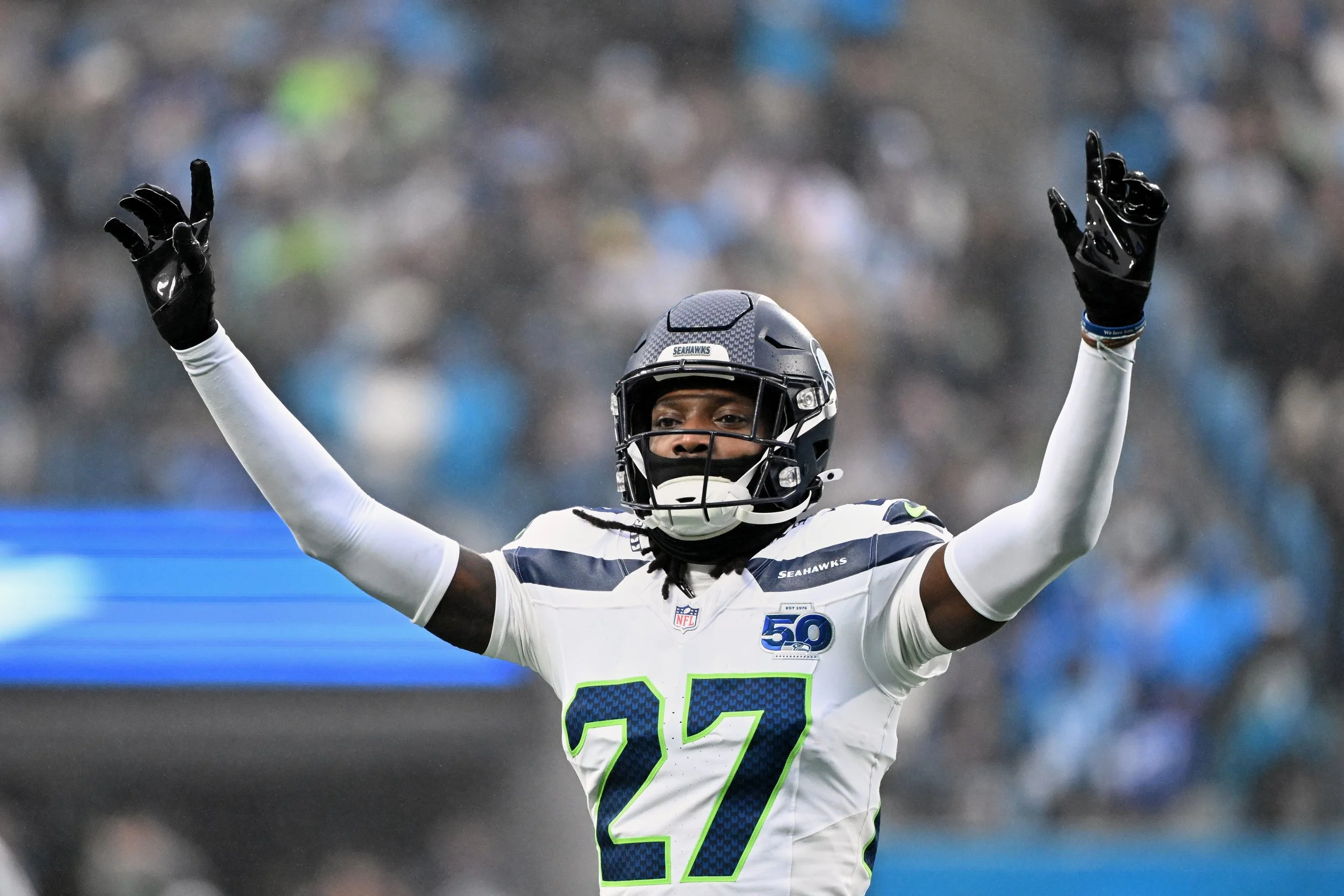 Seattle Seahawks cornerback Riq Woolen (27) reacts against the Carolina Panthers during the second quarter at Bank of America Stadium. Mandatory Credit: Bob Donnan-Imagn Images