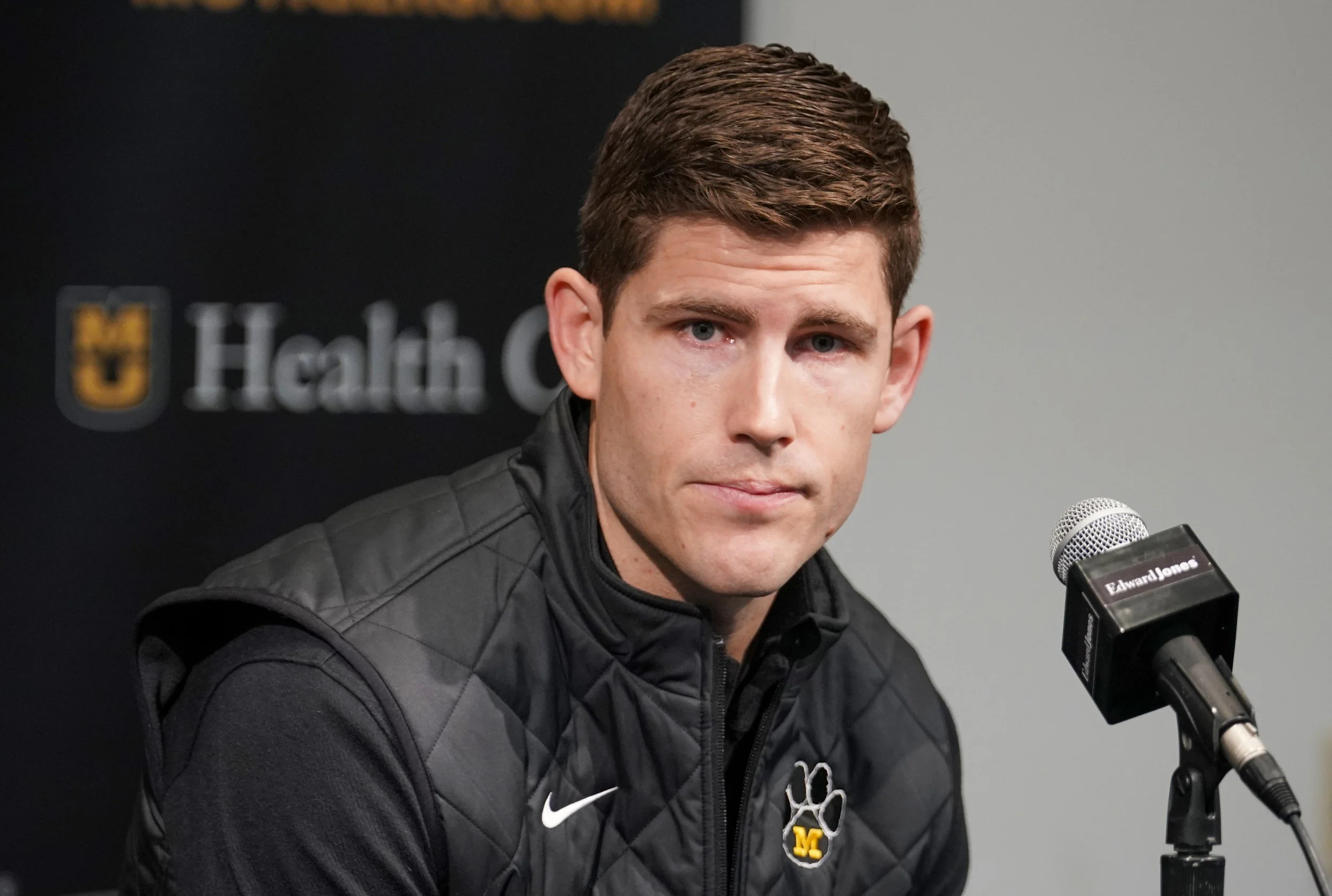 Missouri Tigers football team new offensive coordinator/quarterbacks coach Kirby Moore answers questions from reporters before the basketball game against the Vanderbilt Commodores Mizzou Arena. Mandatory Credit: Denny Medley-Imagn Images
