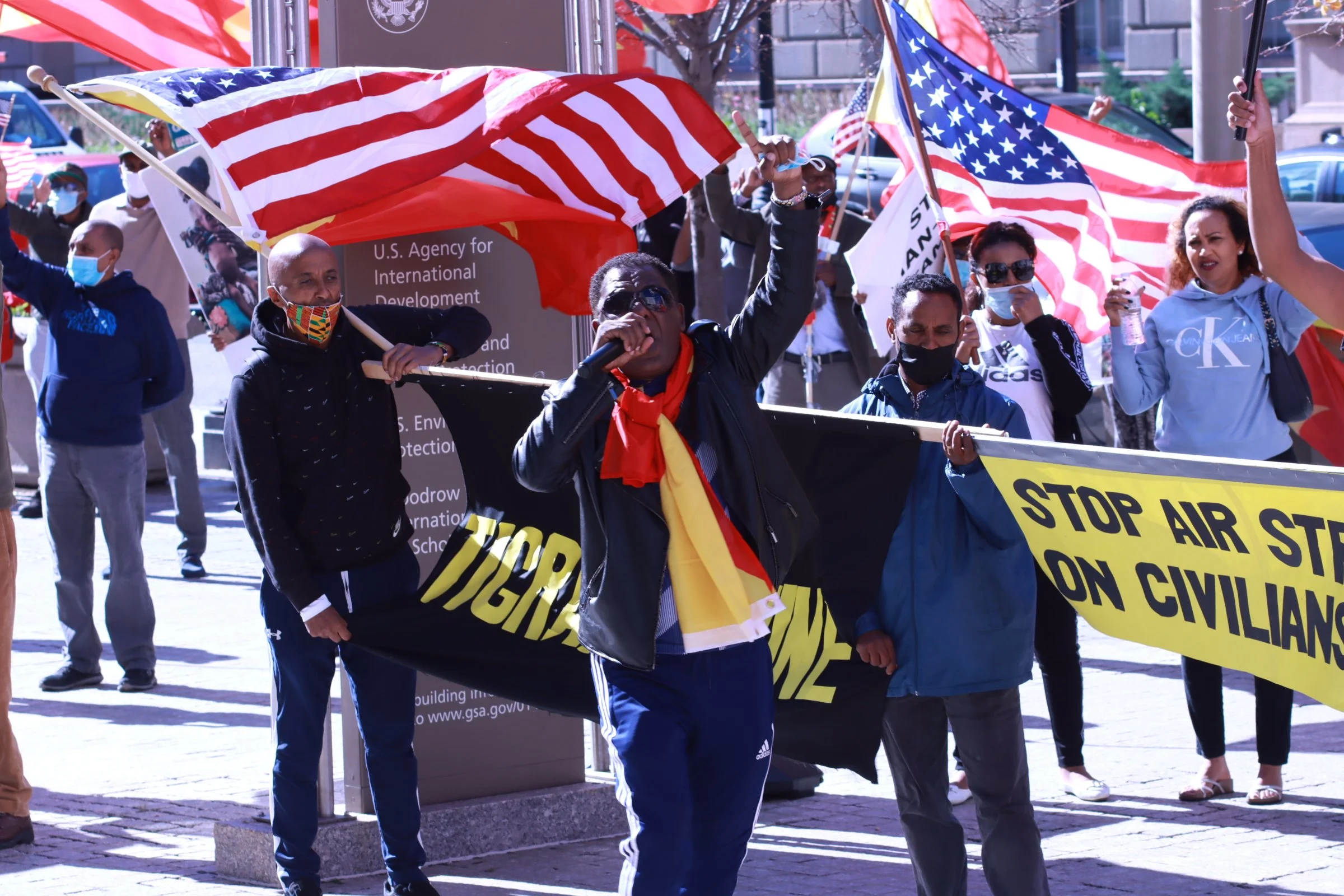 tigray ethiopian protest in washington dc during biden presidency, leader of protest speaking to followers