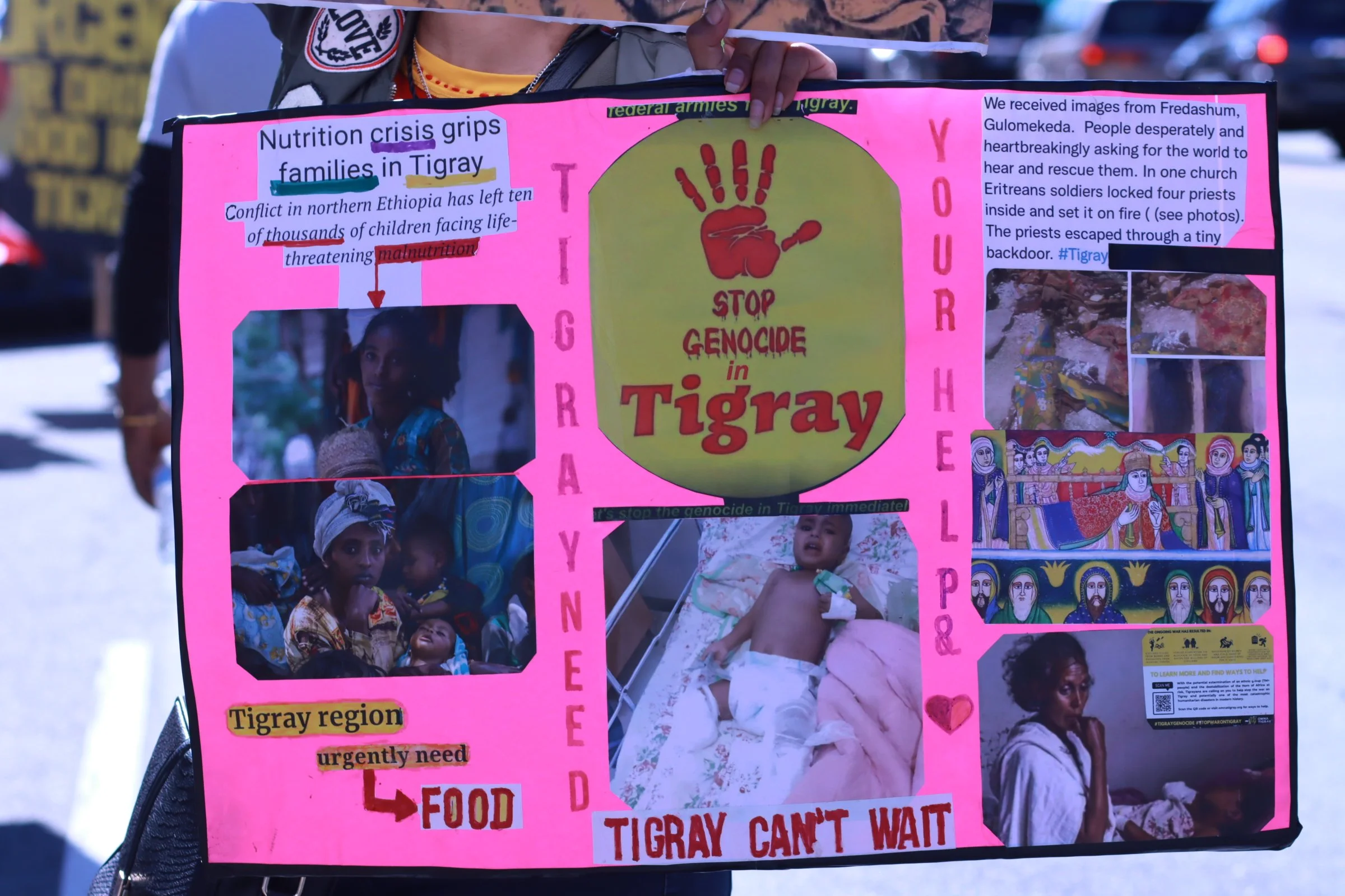 tigray ethiopian protest in washington dc during biden presidency a woman holding a sign of the lack of nutrition in tigray families are receiving