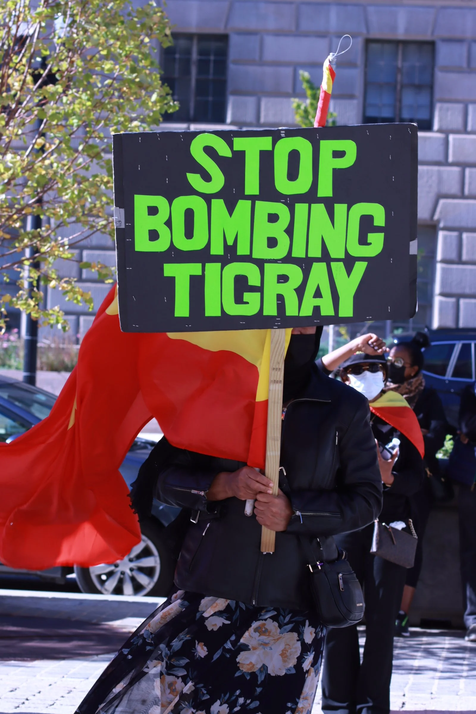 tigray ethiopian protest in washington dc during biden presidency, stop bombing tigray sign 