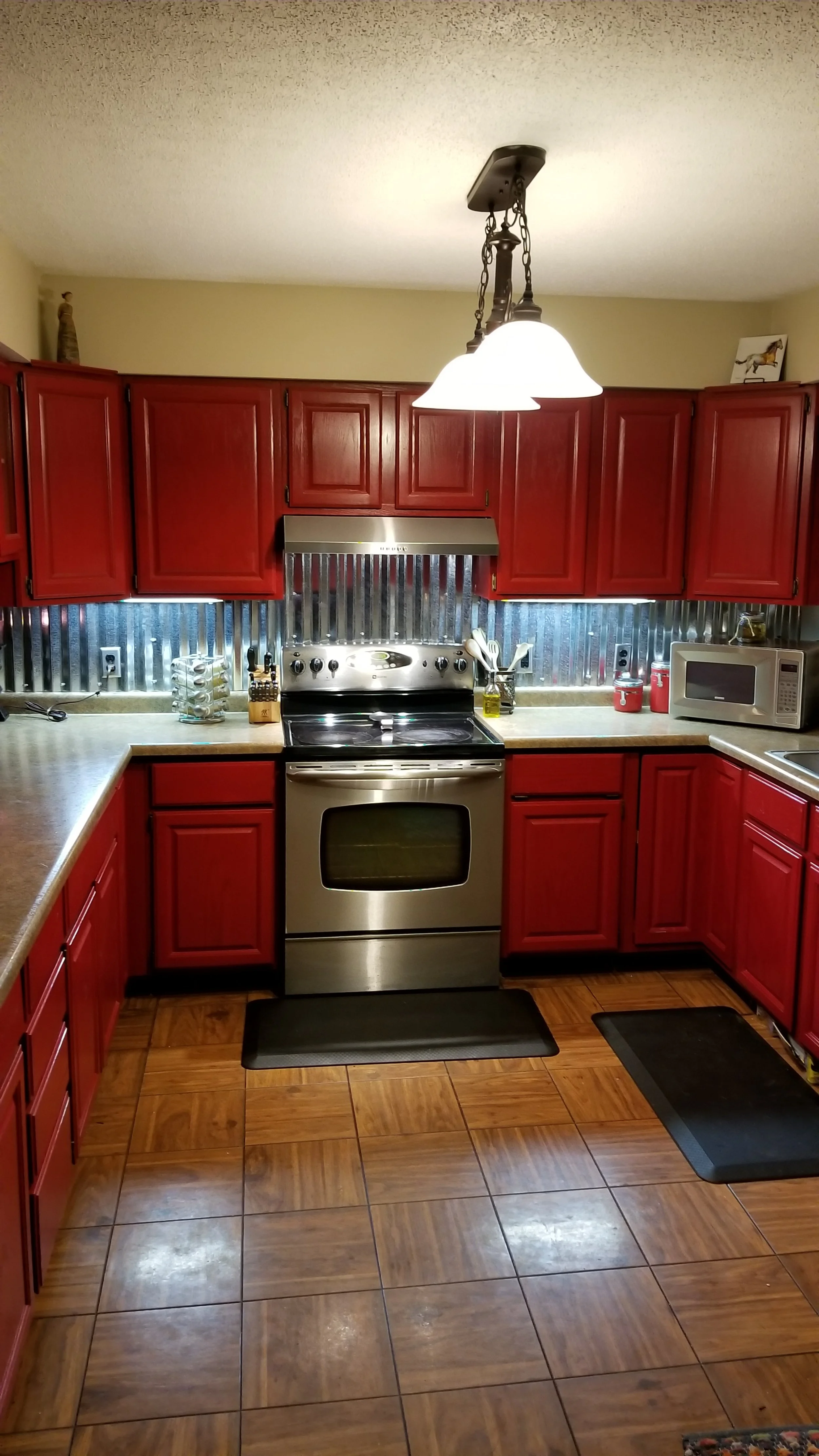 re painted these old dusty cabinets and added the galvanized steel backsplash