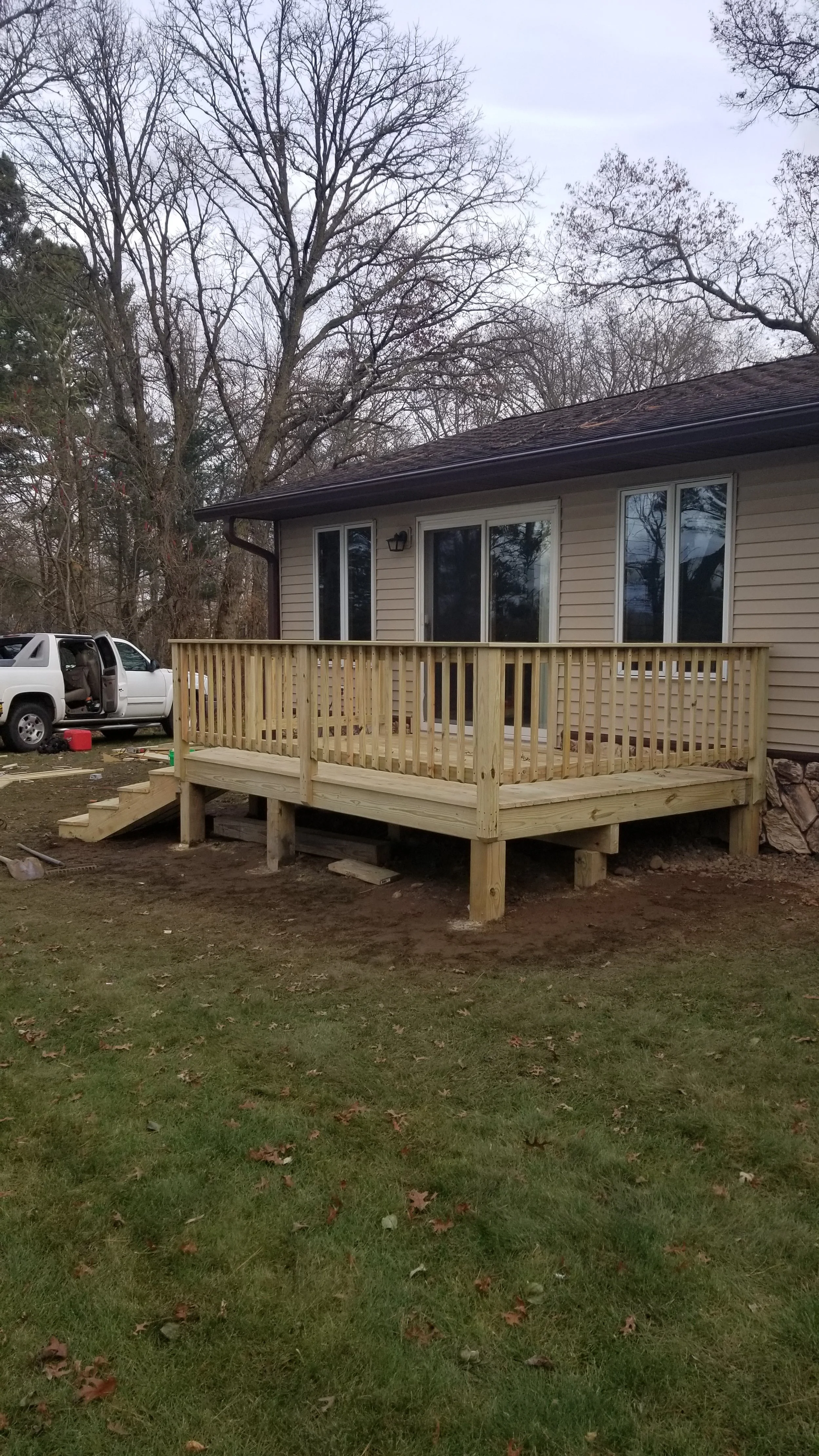 I buil12x14 foot new built deck, excavation, framing on the Chippewa River. 
