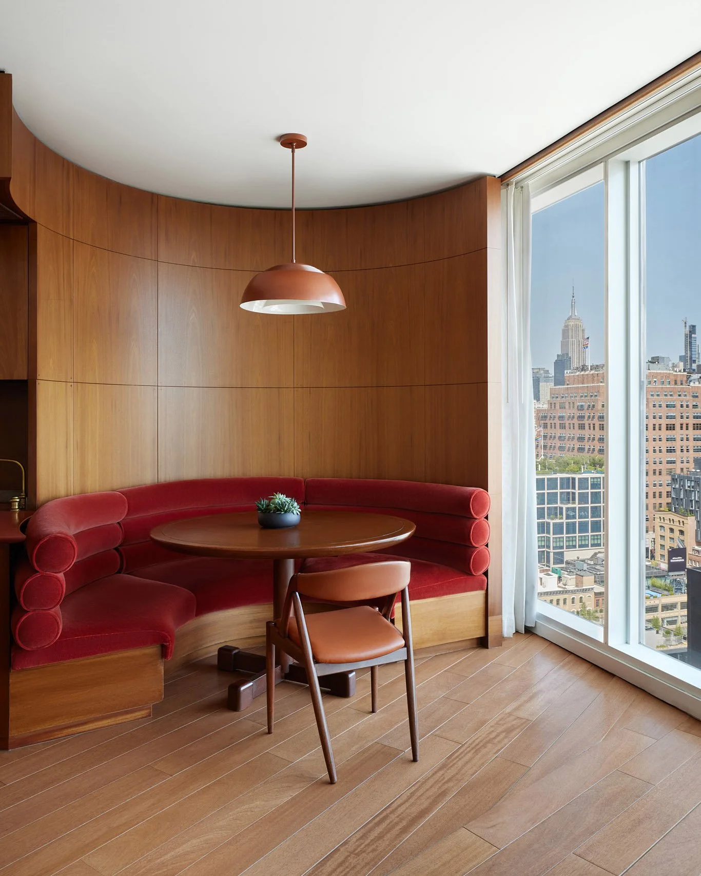 Hospitality photographer photographs a hotel room in Manhattan with a view of the Empire State building