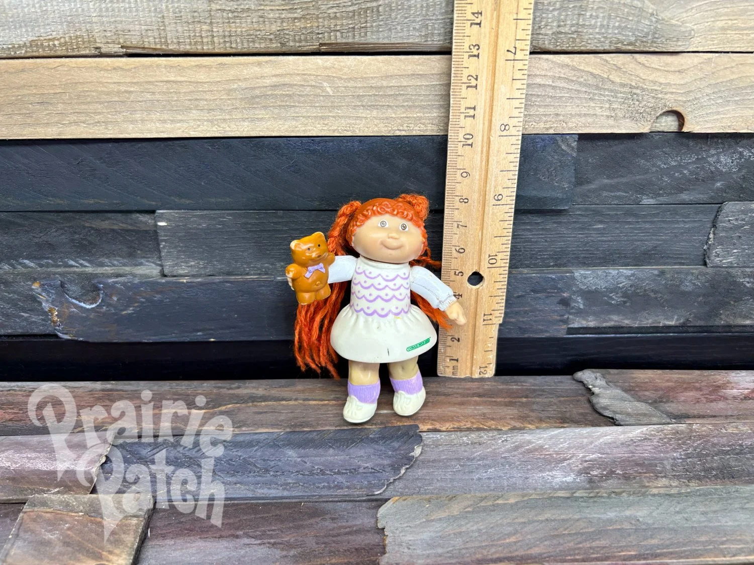 Figurine with teddy bear