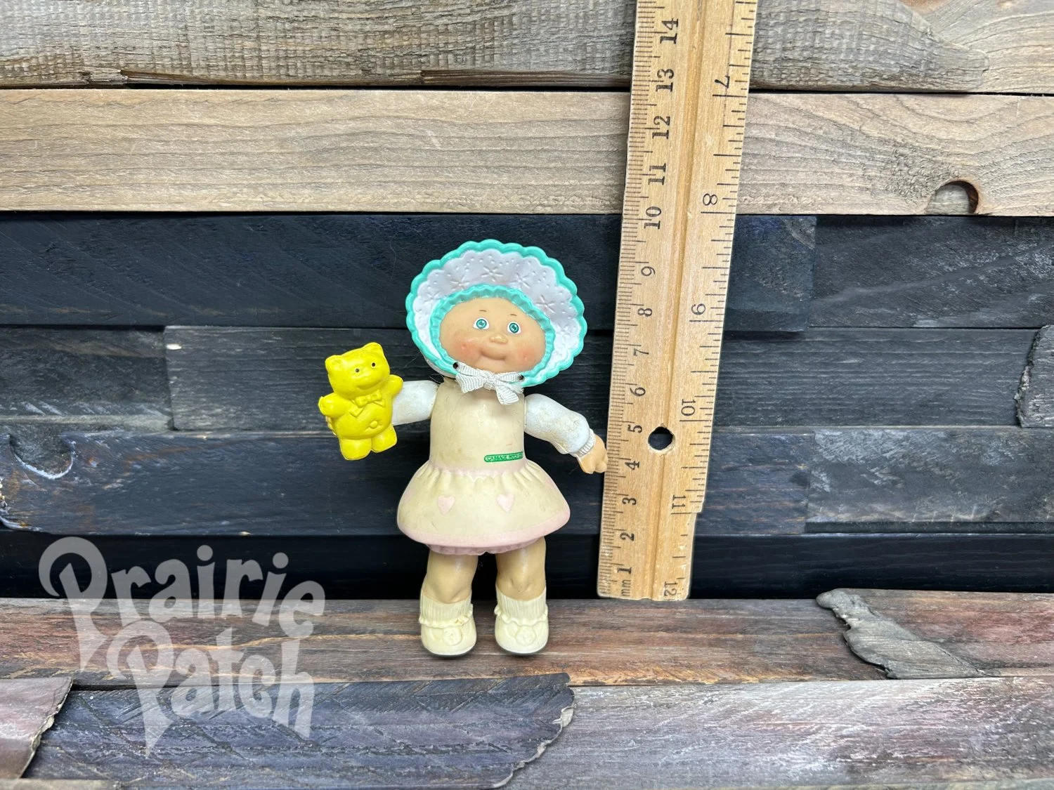 Figurine with teddy bear