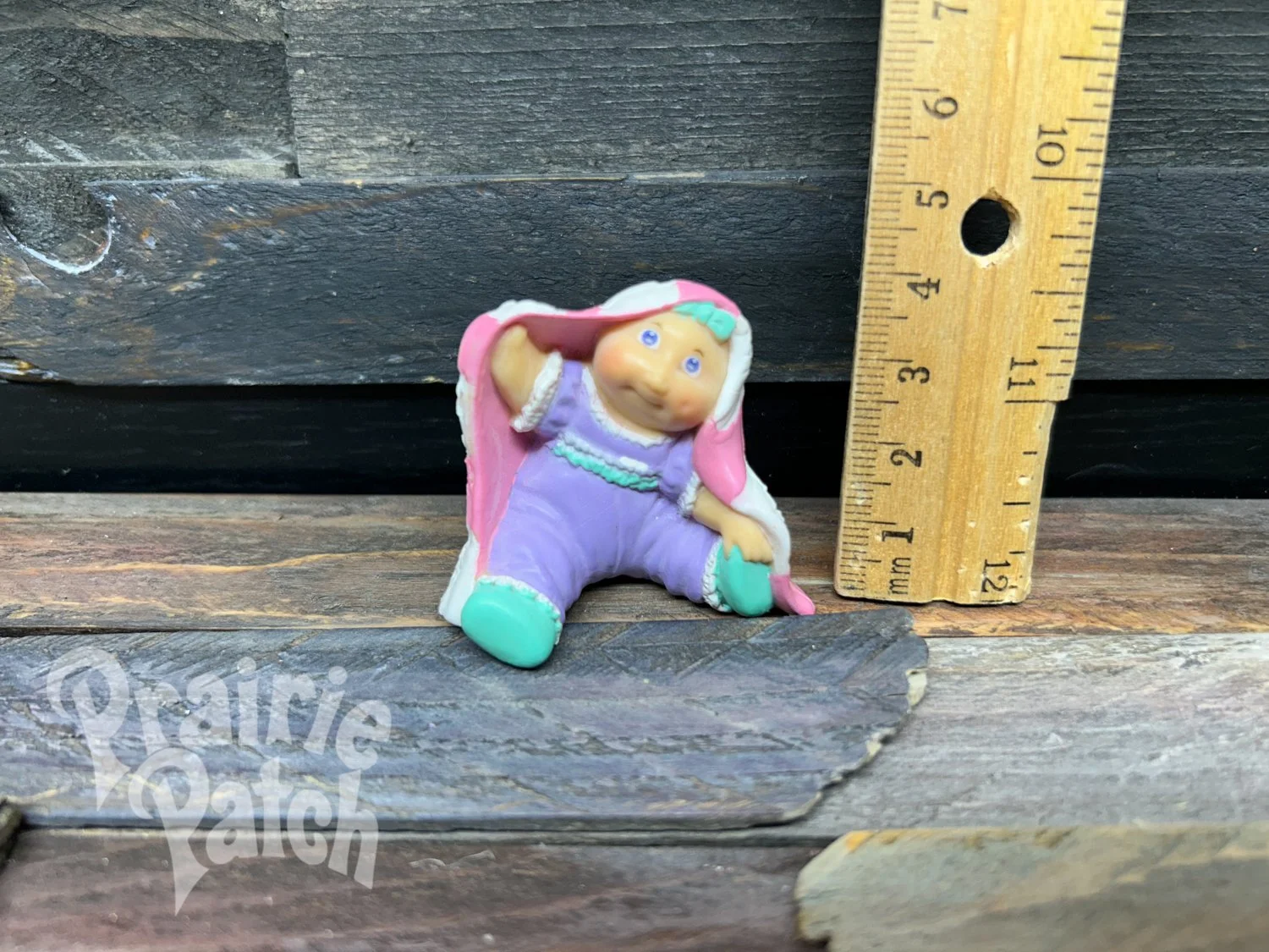 Peek a boo baby figurine