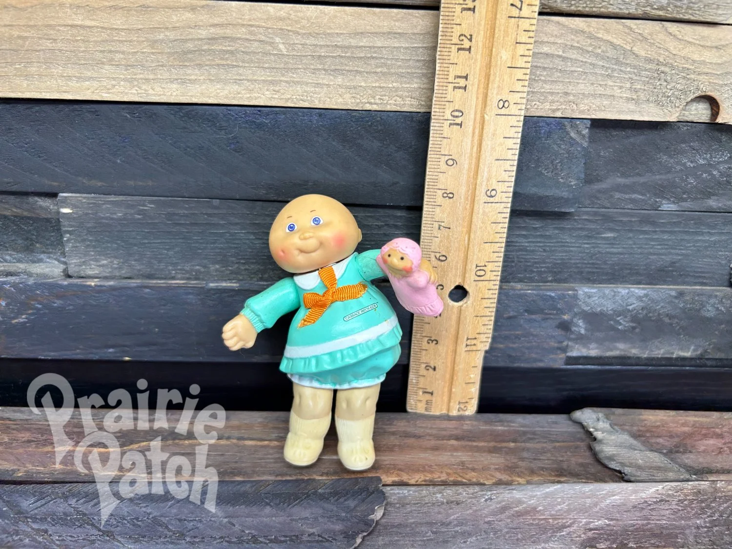 Figurine with doll
