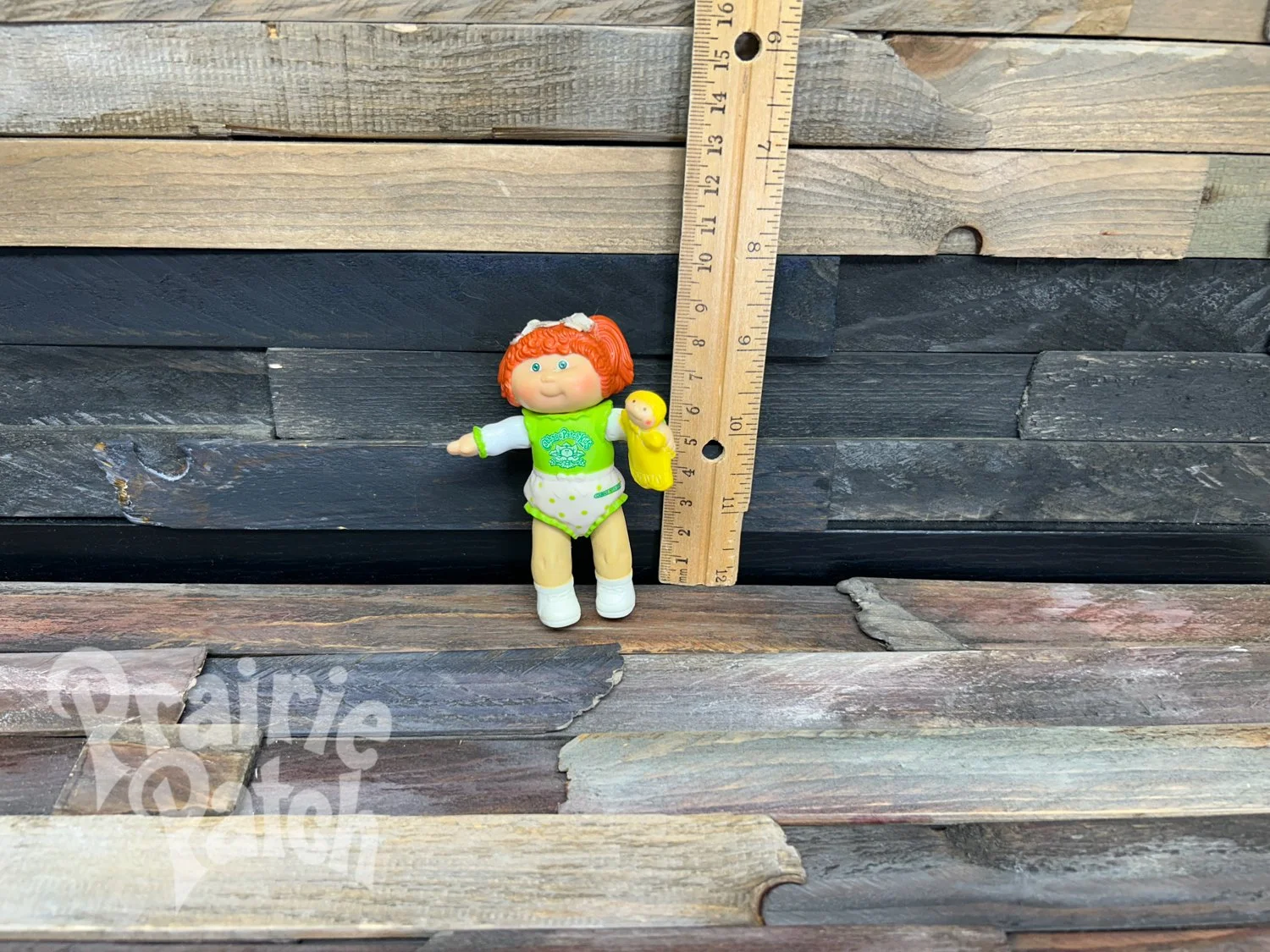 Figurine with doll