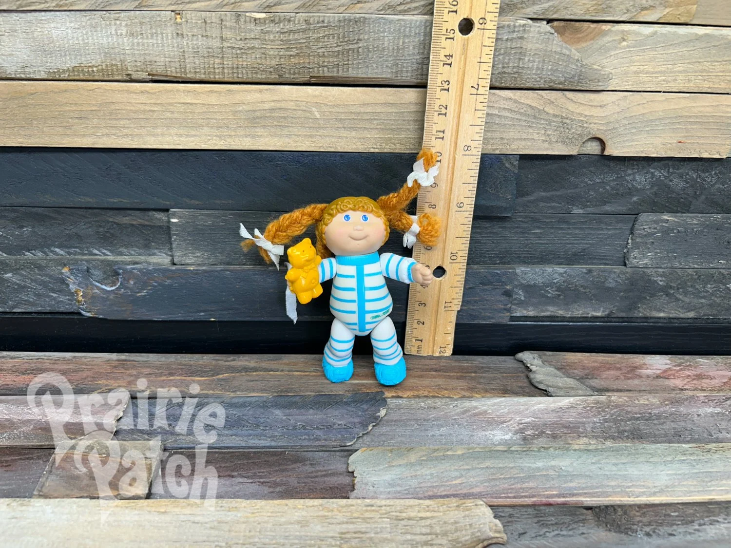 Figurine with teddy bear