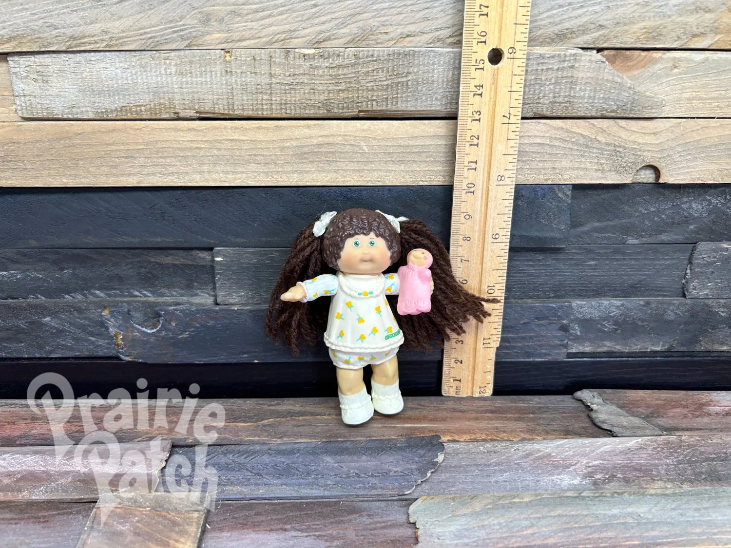 Figurine with doll