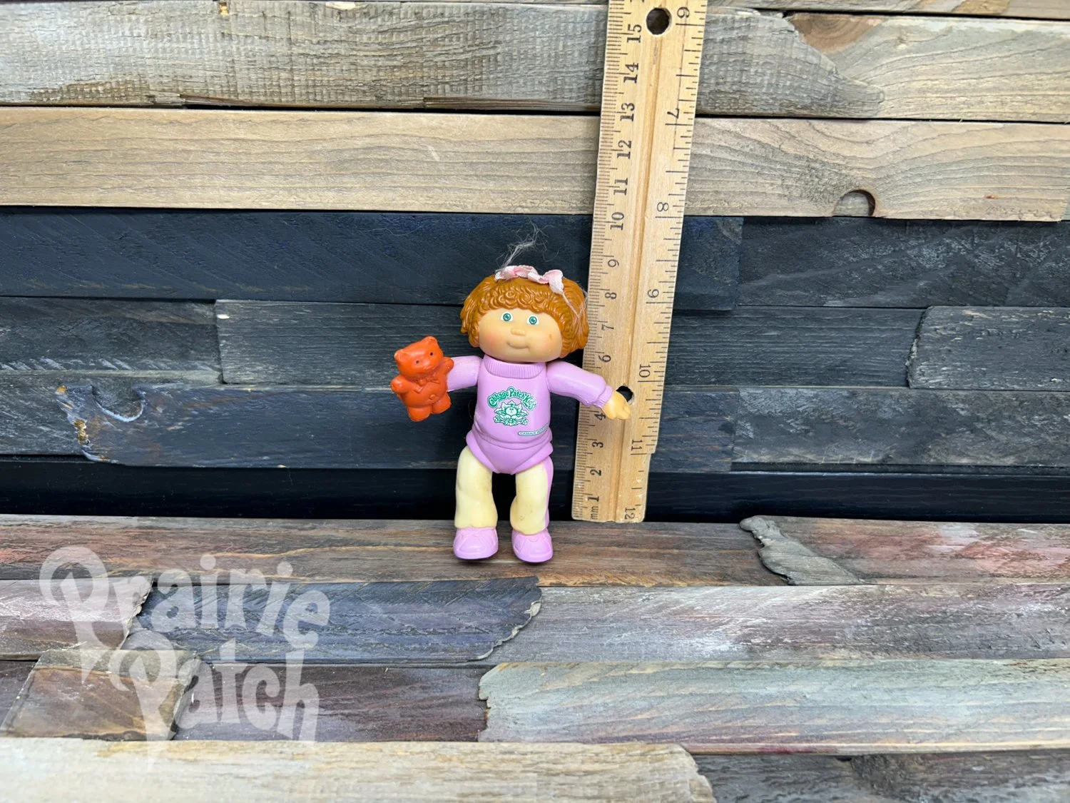 Figurine with teddy bear
