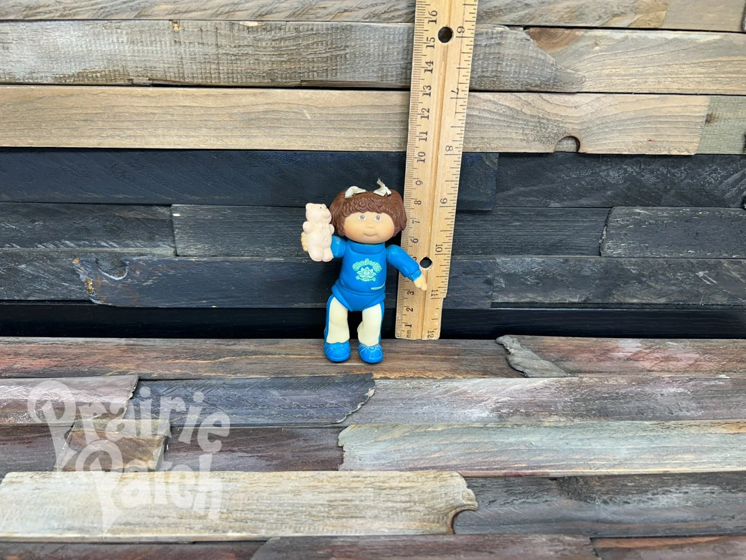 Figurine with teddy bear