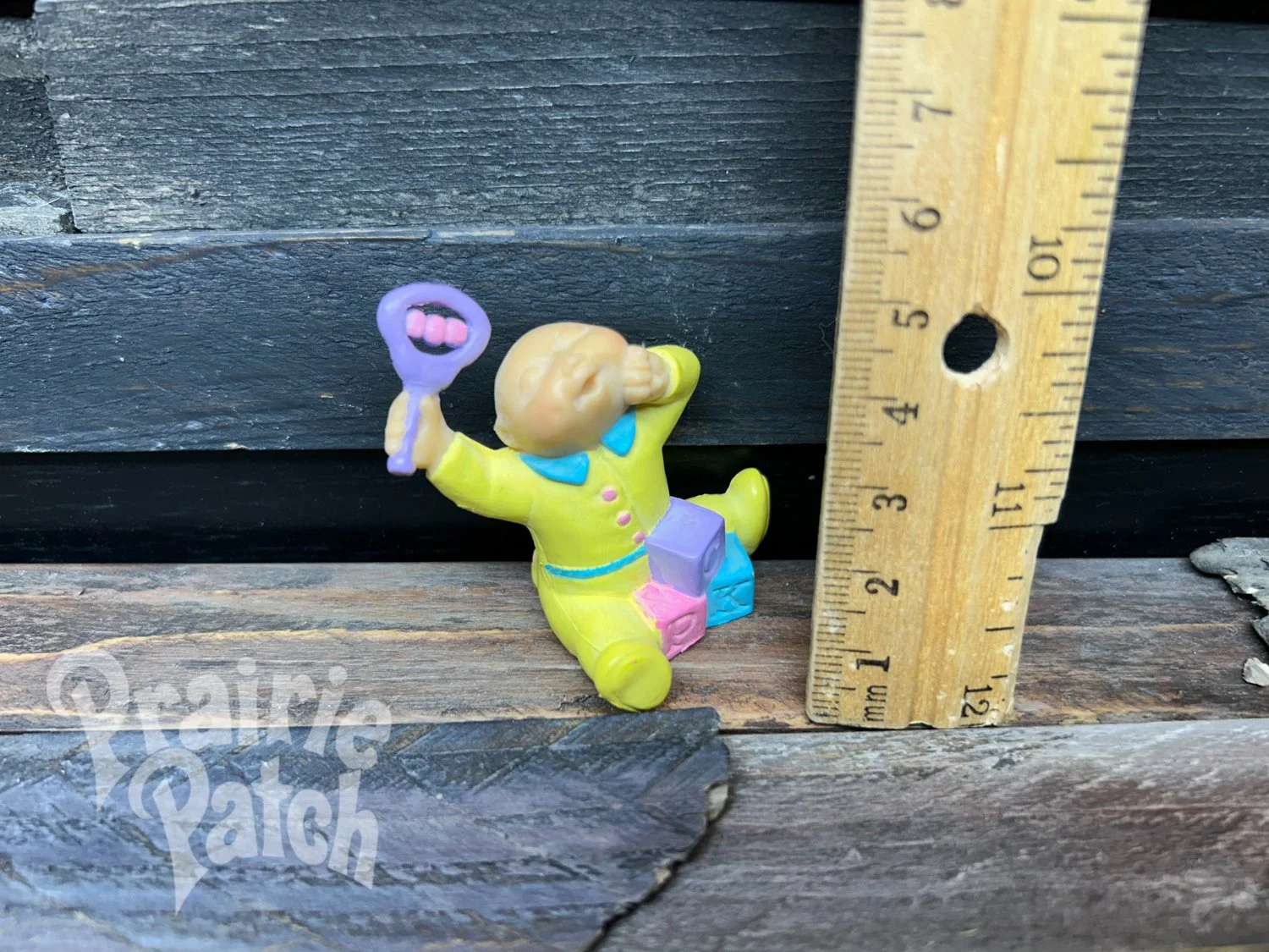 Stretching baby figurine