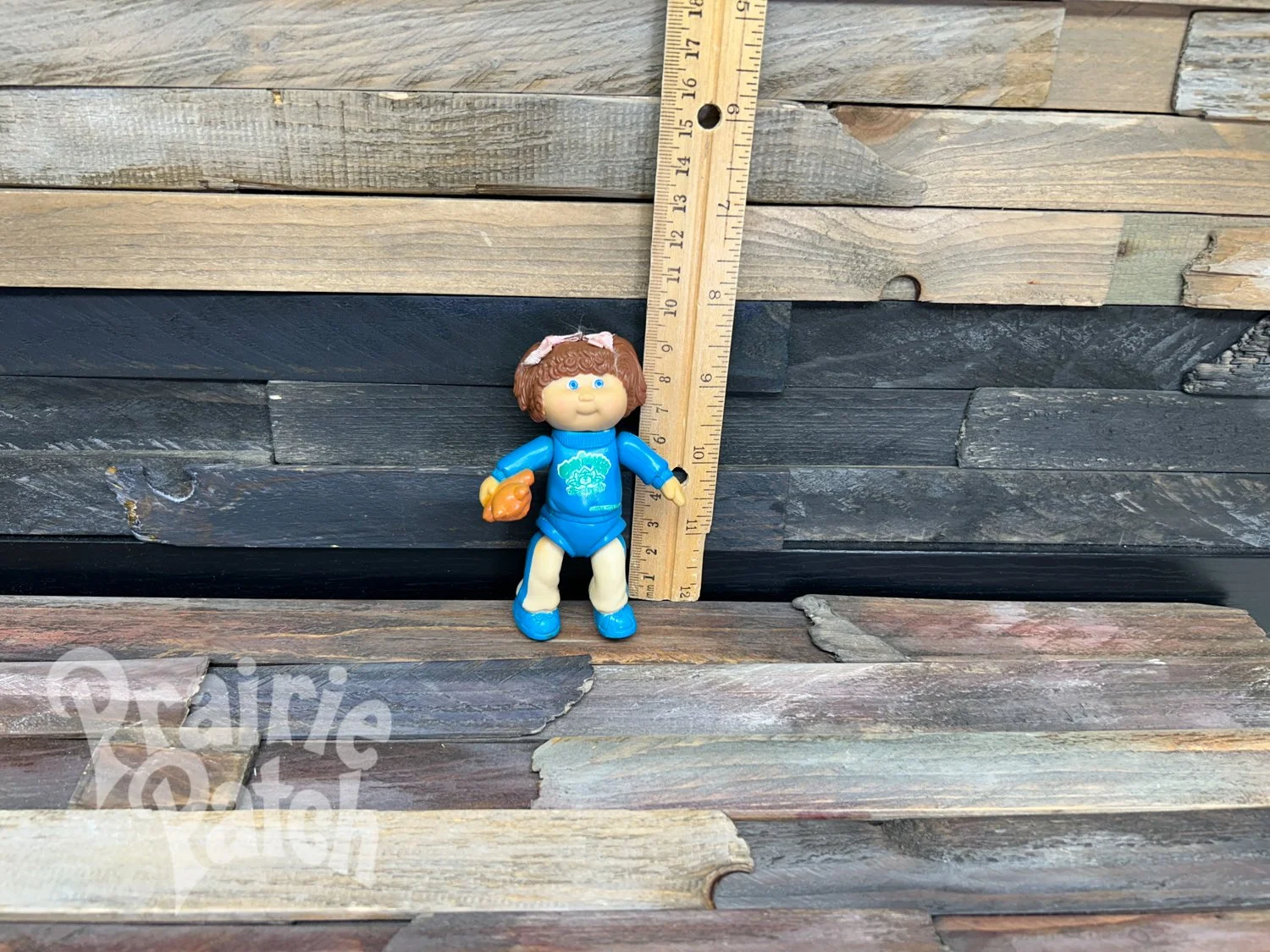Figurine with teddy bear
