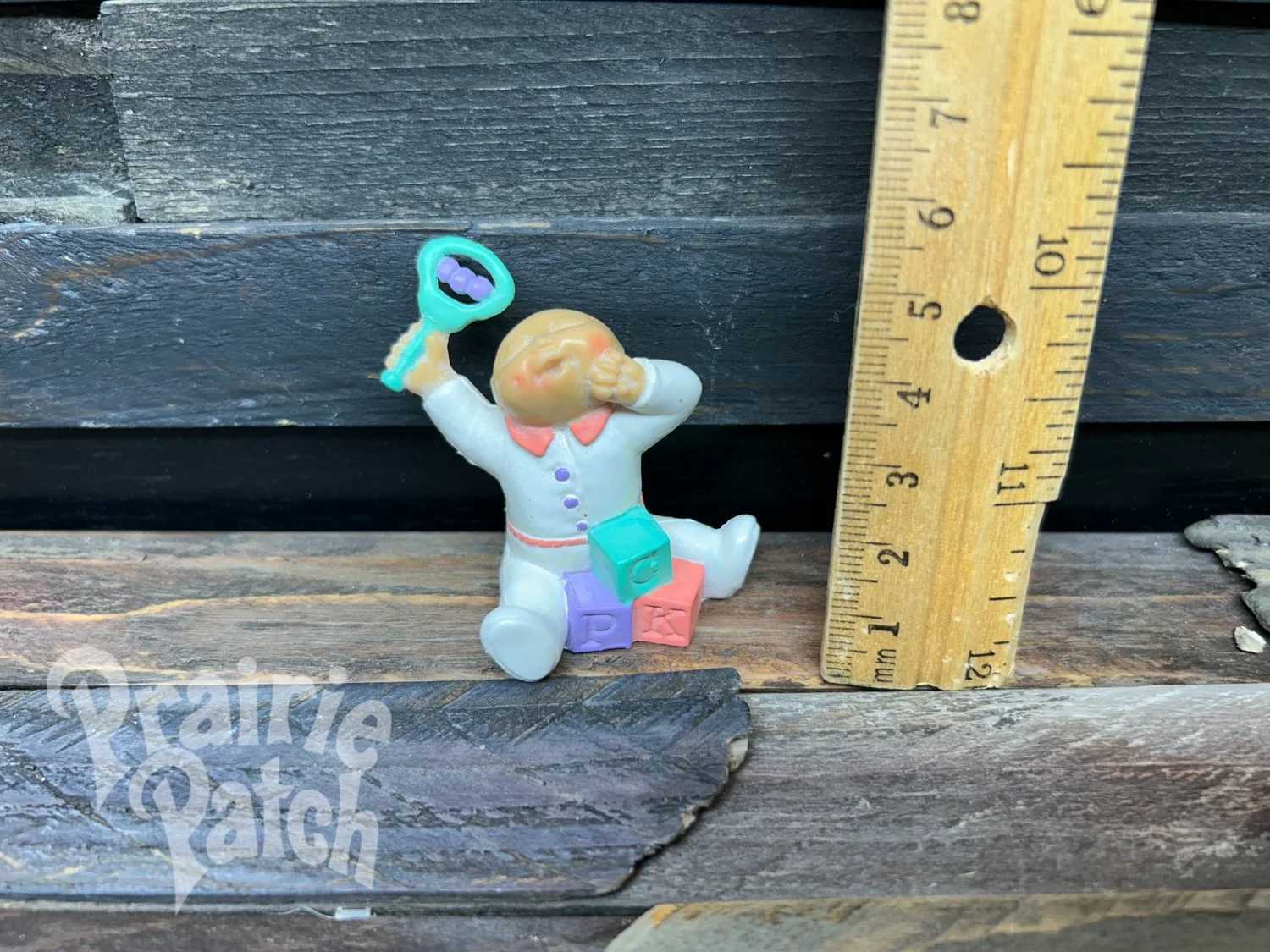 Stretching baby figurine