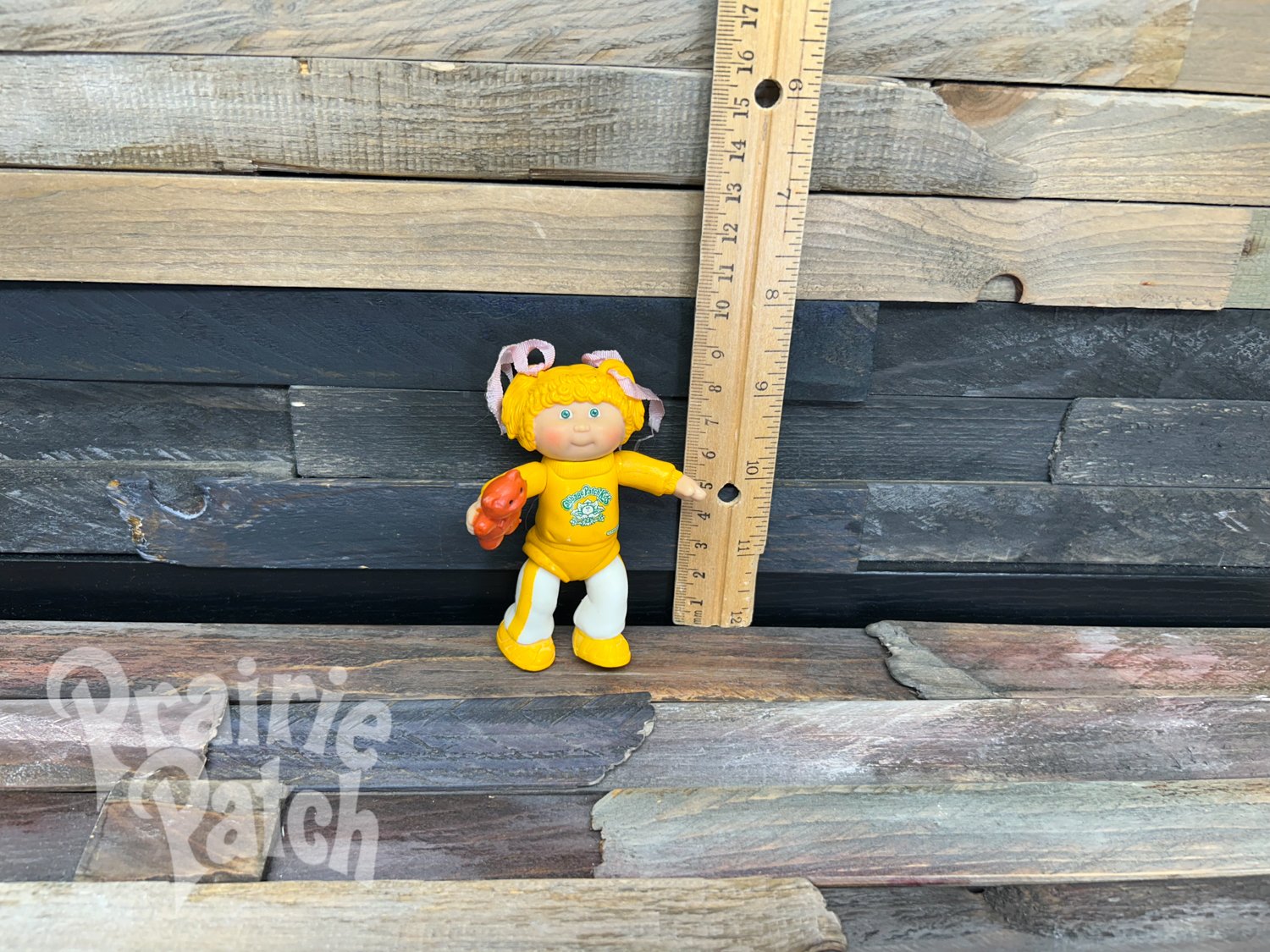 Figurine with teddy bear