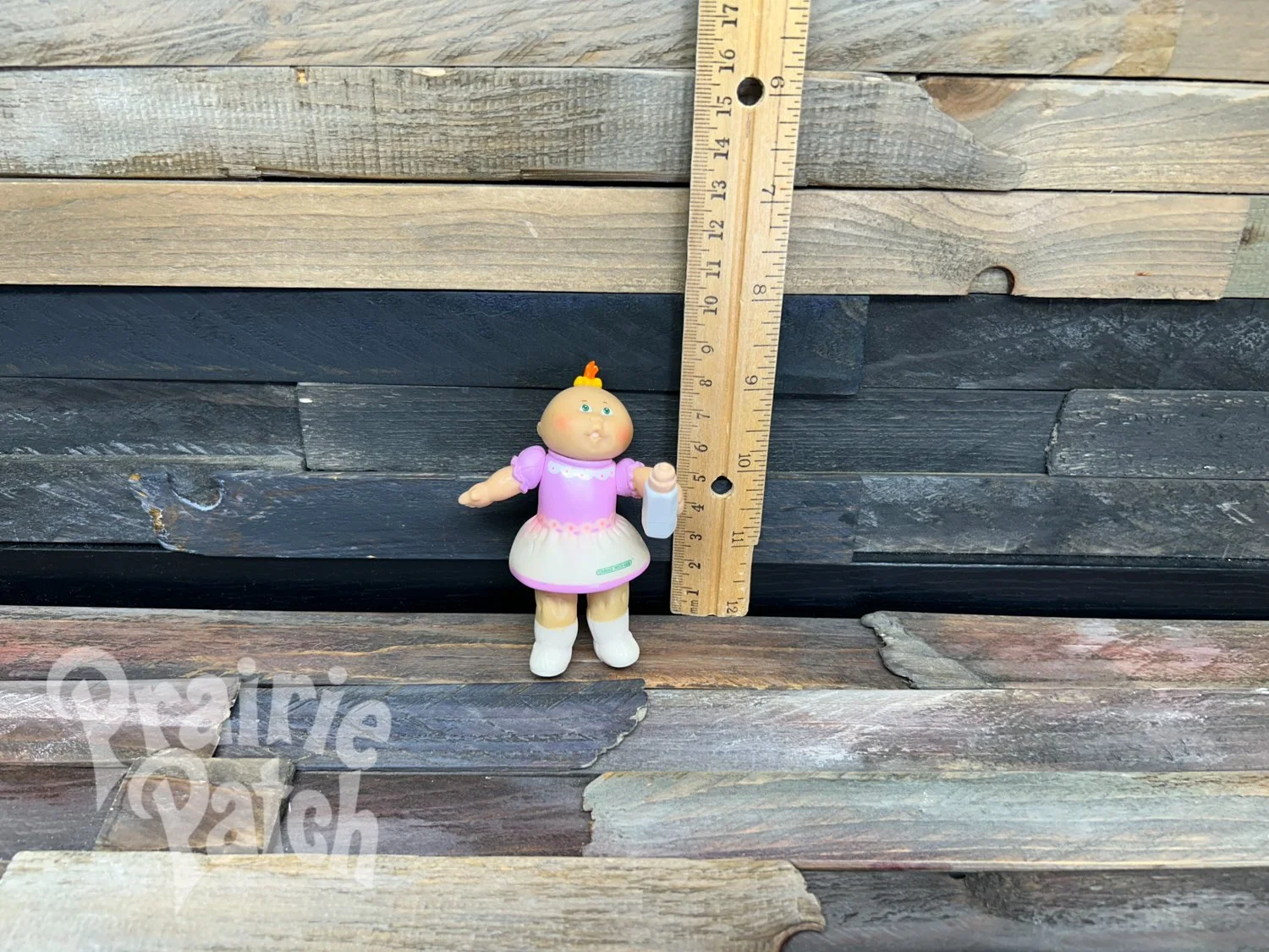 Figurine with bottle
