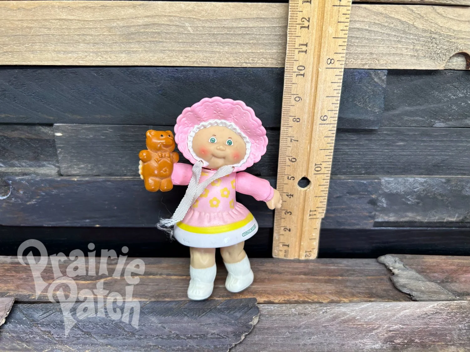 Figurine with teddy bear