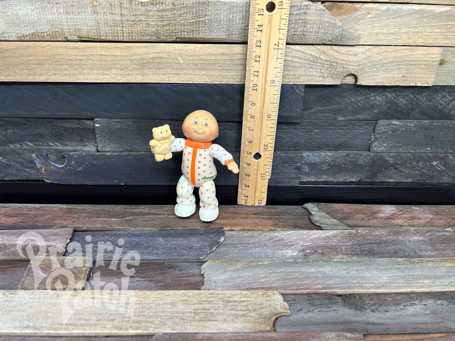 Figurine with teddy bear