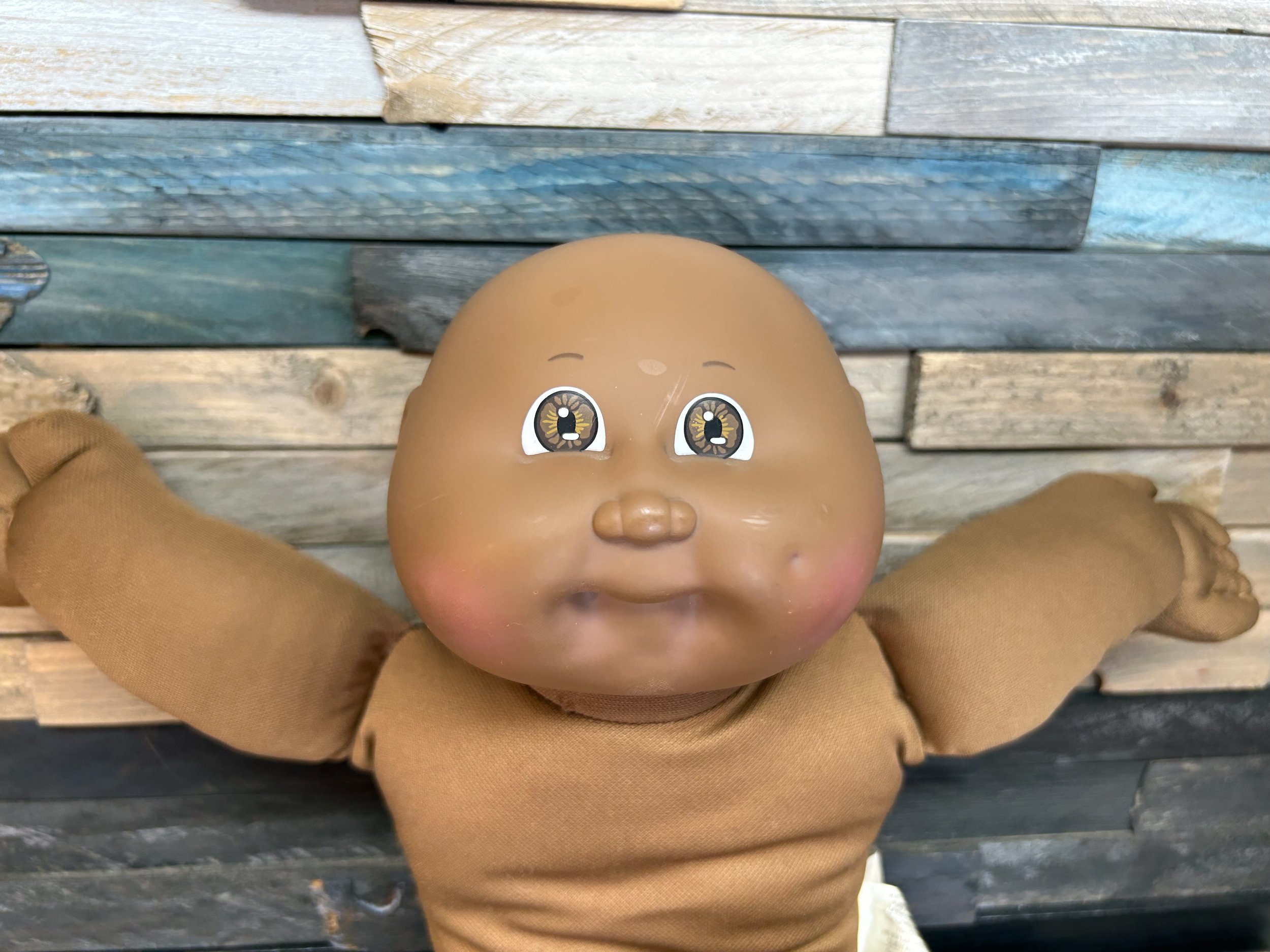 Bald, brown eyes**