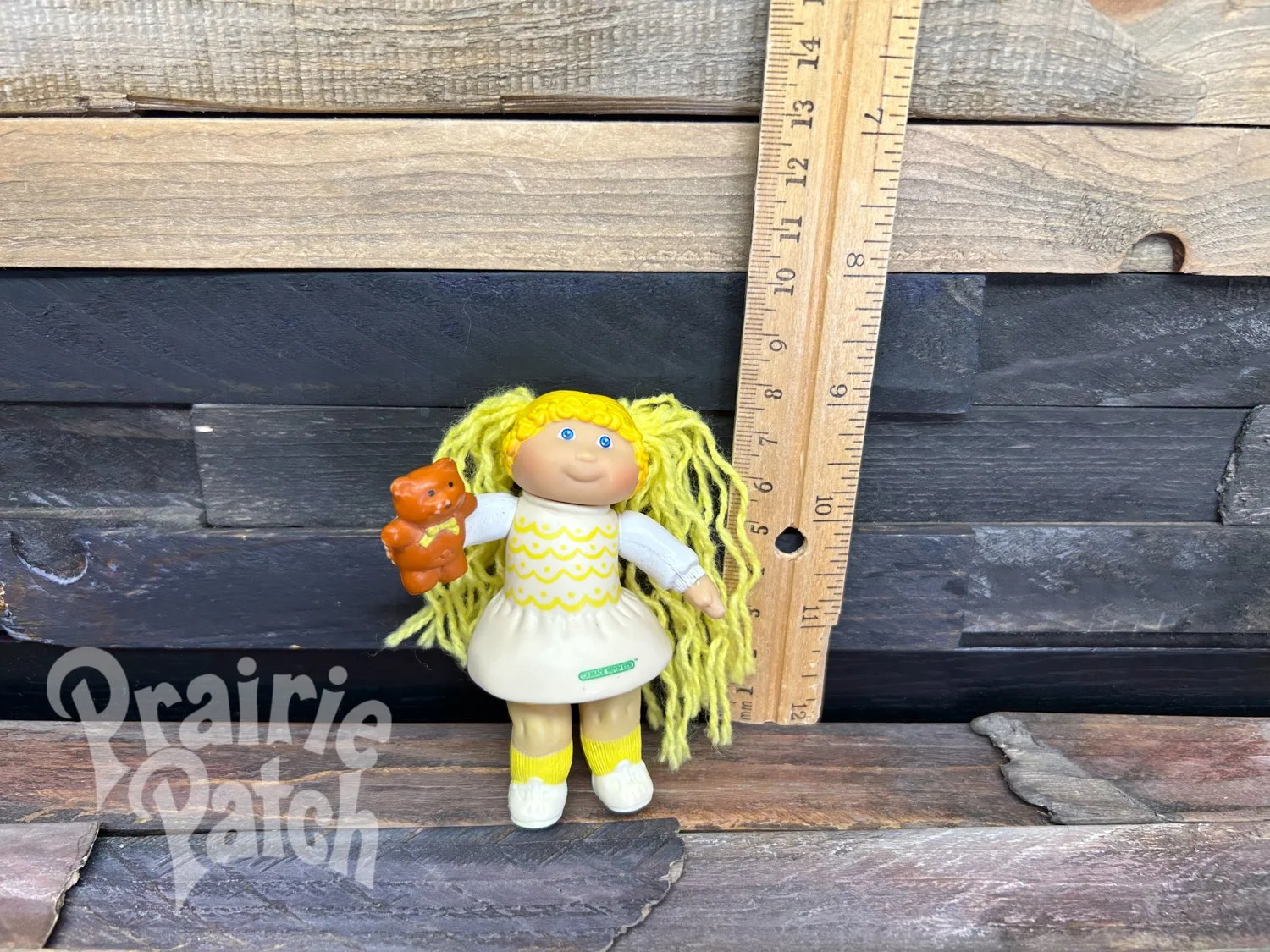 Figurine with teddy bear