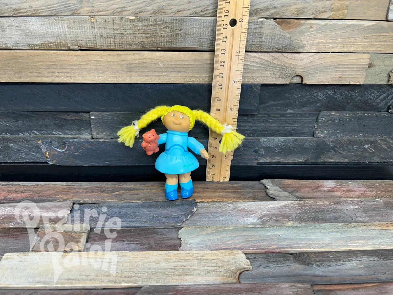 Figurine with teddy bear