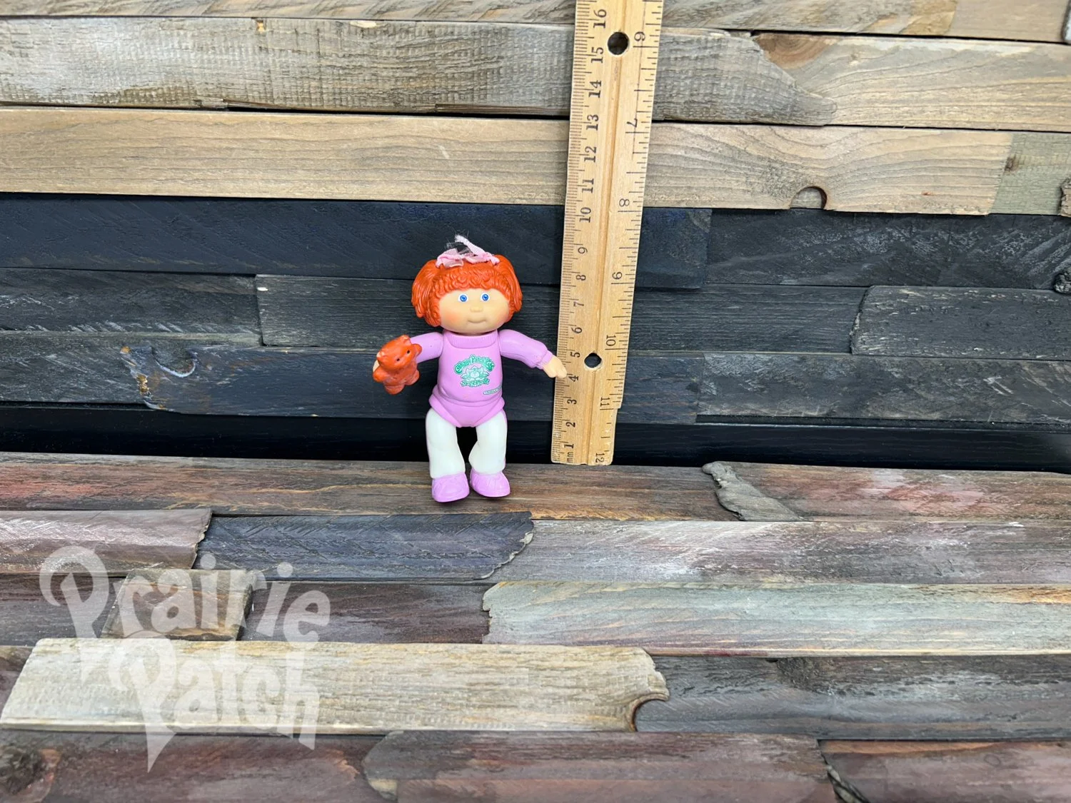 Figurine with teddy bear