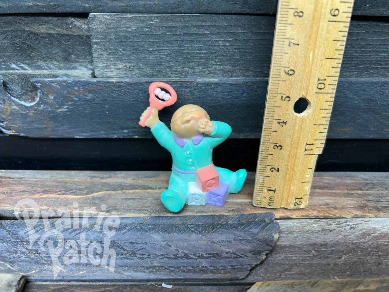 Stretching baby figurine