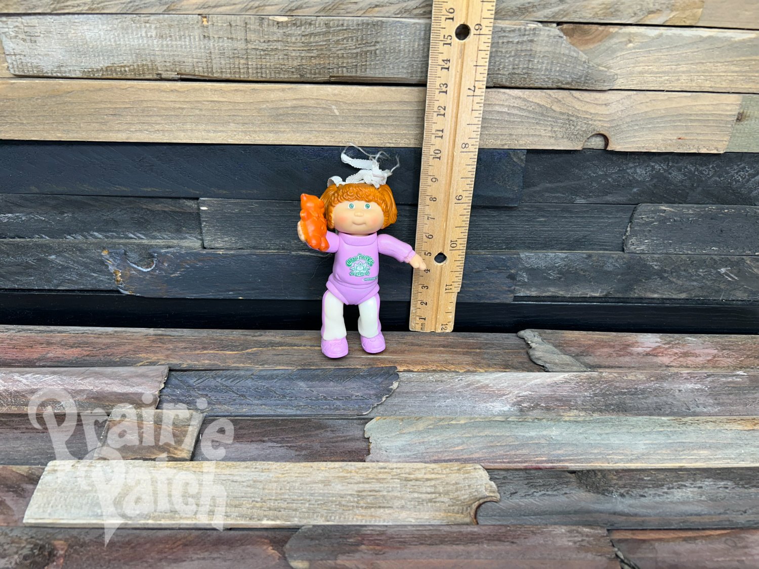 Figurine with teddy bear